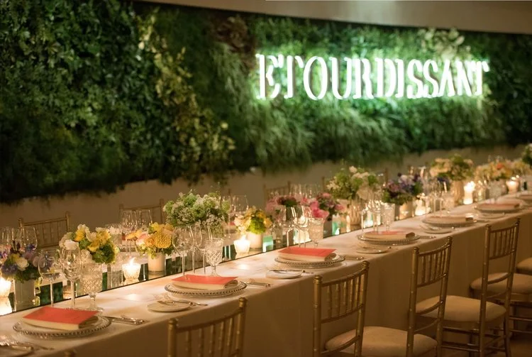 Dinner look with all candles lighted on a mirrored table runner