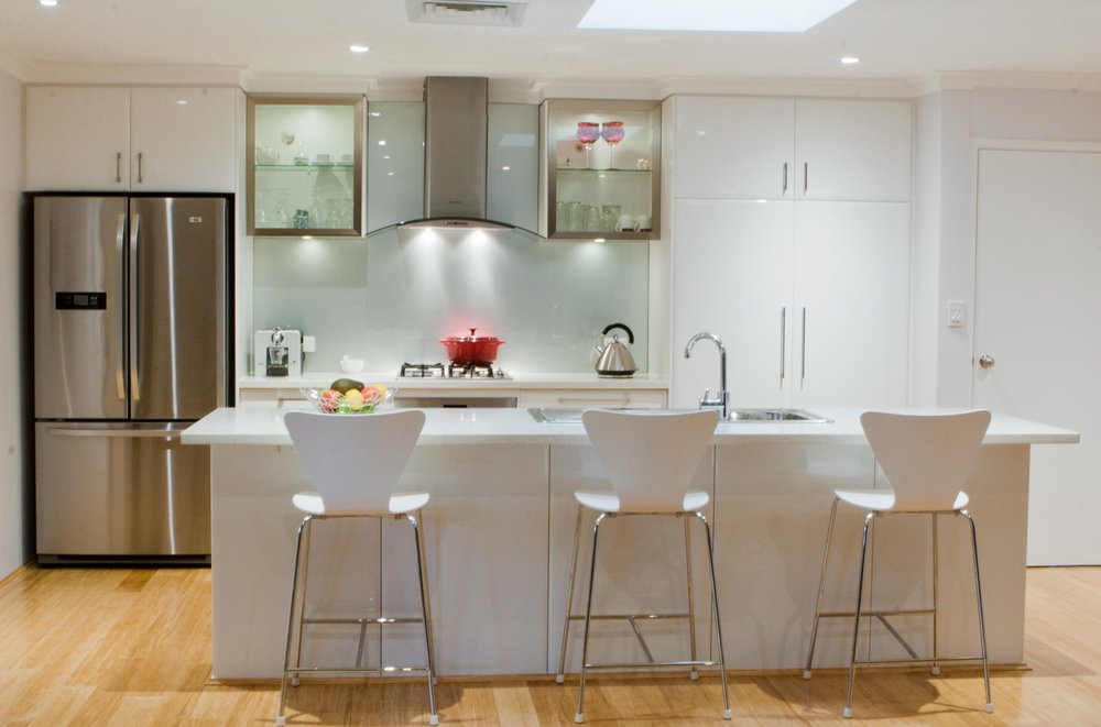 Lesley & Peter After - QN Designs Solutions 1. Removal wall on left hand side for kitchen space to work in the pervious hallway space and allow for open plan kitchen. 2. Upgrade walk-in pantry to double door pull out drawers to effective use of space. 3. Move cooktop to centre of the back kitchen wall, to allow for cooking work bench on left and right of cooktop. 4. Custom make fridge recess cabinetry to allow new stainless steel fridge. 5. Designed in an large island bench to be used for cooking and breakfast bar.
