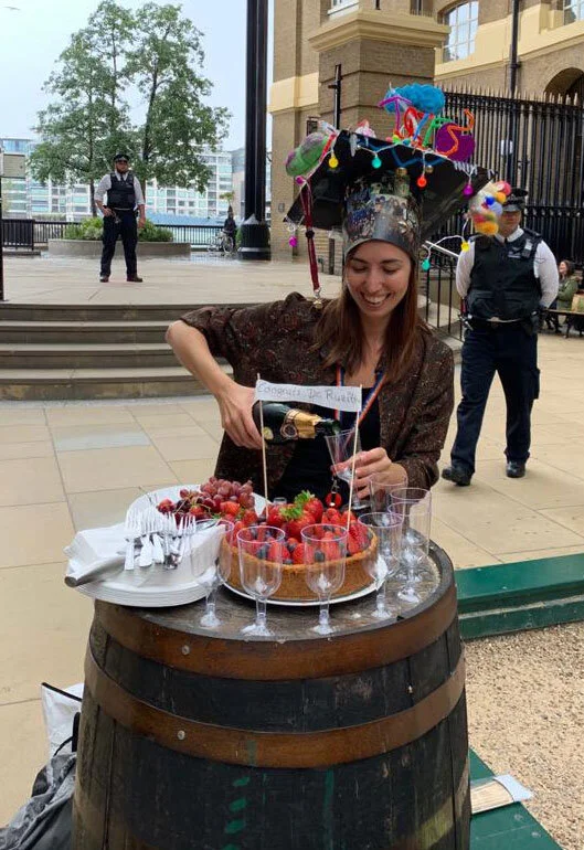 Dr Silvia Ruzittu celebrating her PhD Viva with some cake and champagne.