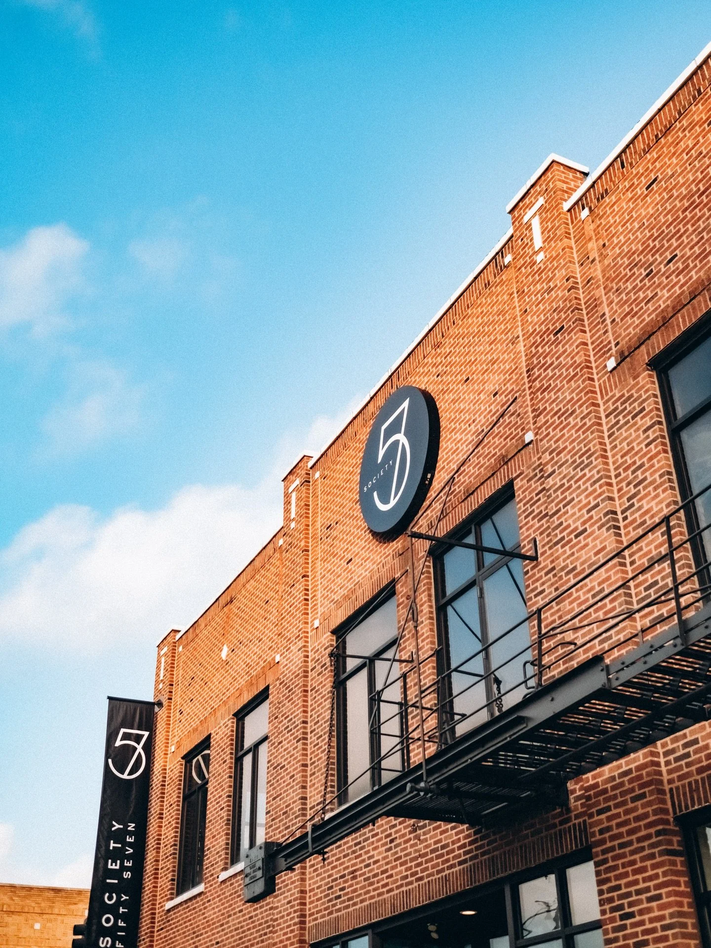 Today in 1857, two sides of a river decided to stop being separate.

East Aurora. West Aurora. One city.

Society 57 carries that spirit forward.

Different industries. Different cultures. 
Different generations. One place.

We don&rsquo;t exist just