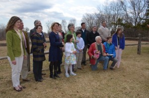 The Connelly family standing in the field they have protected with a Conservation Easement. Photo by Jane Hamilton-Merritt