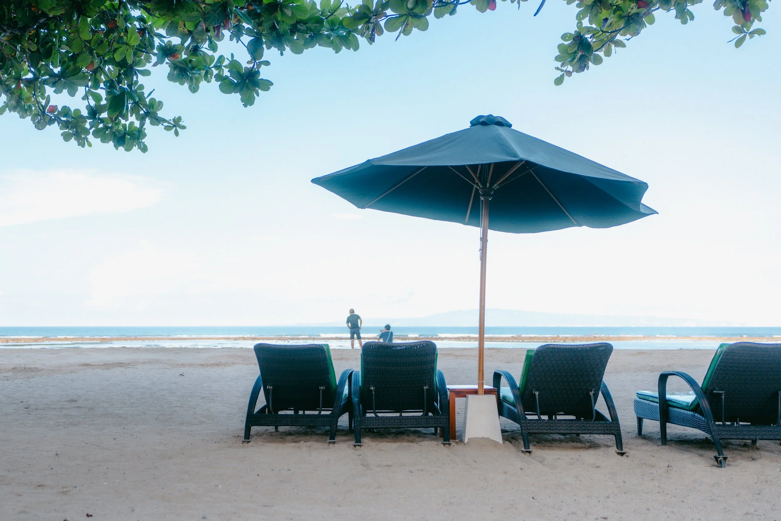  Loungers outside the Bali Beach Hotel. Opened in 1966, the hotel is situated near what historians claim were the burned remains of a village targeted during the anti-communist violence. 