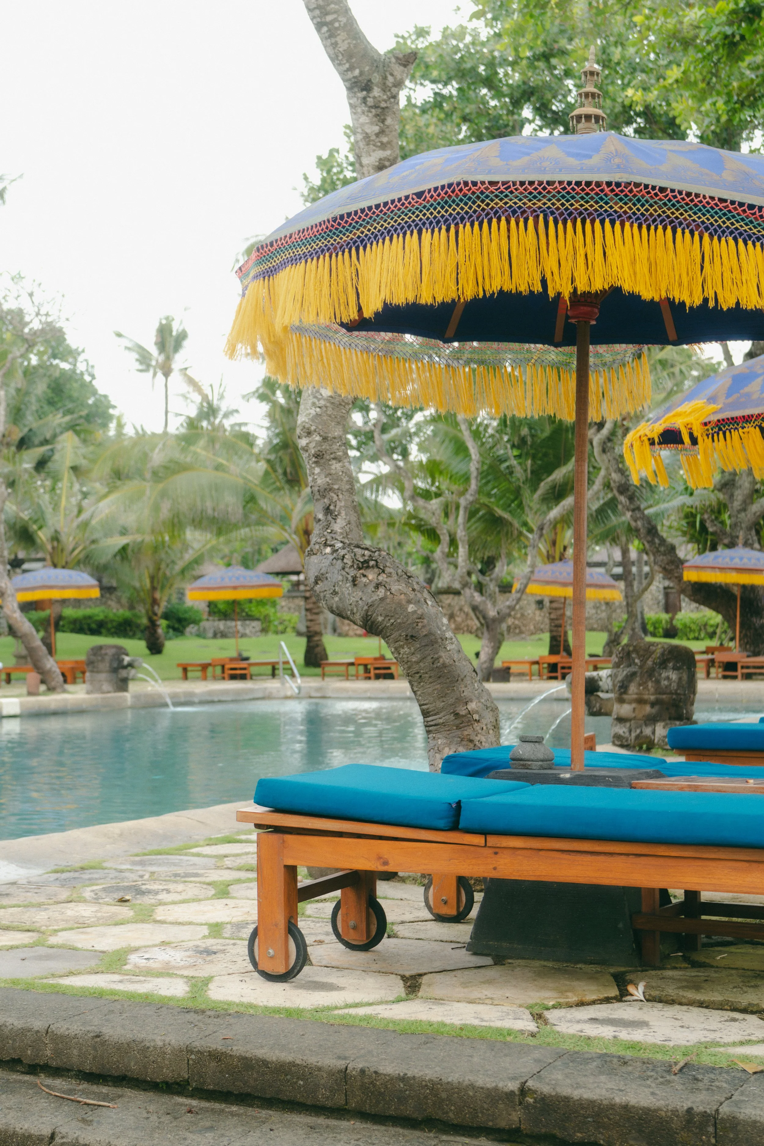  Poolside at the Oberoi, set in a landscape where locals speak quietly of unmarked burial sites. 