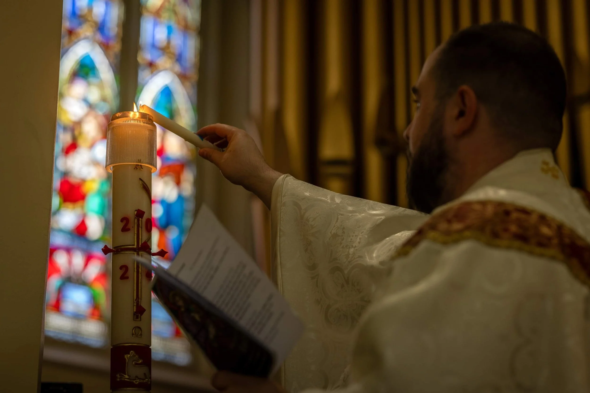 Baptism lighting candle.jpeg