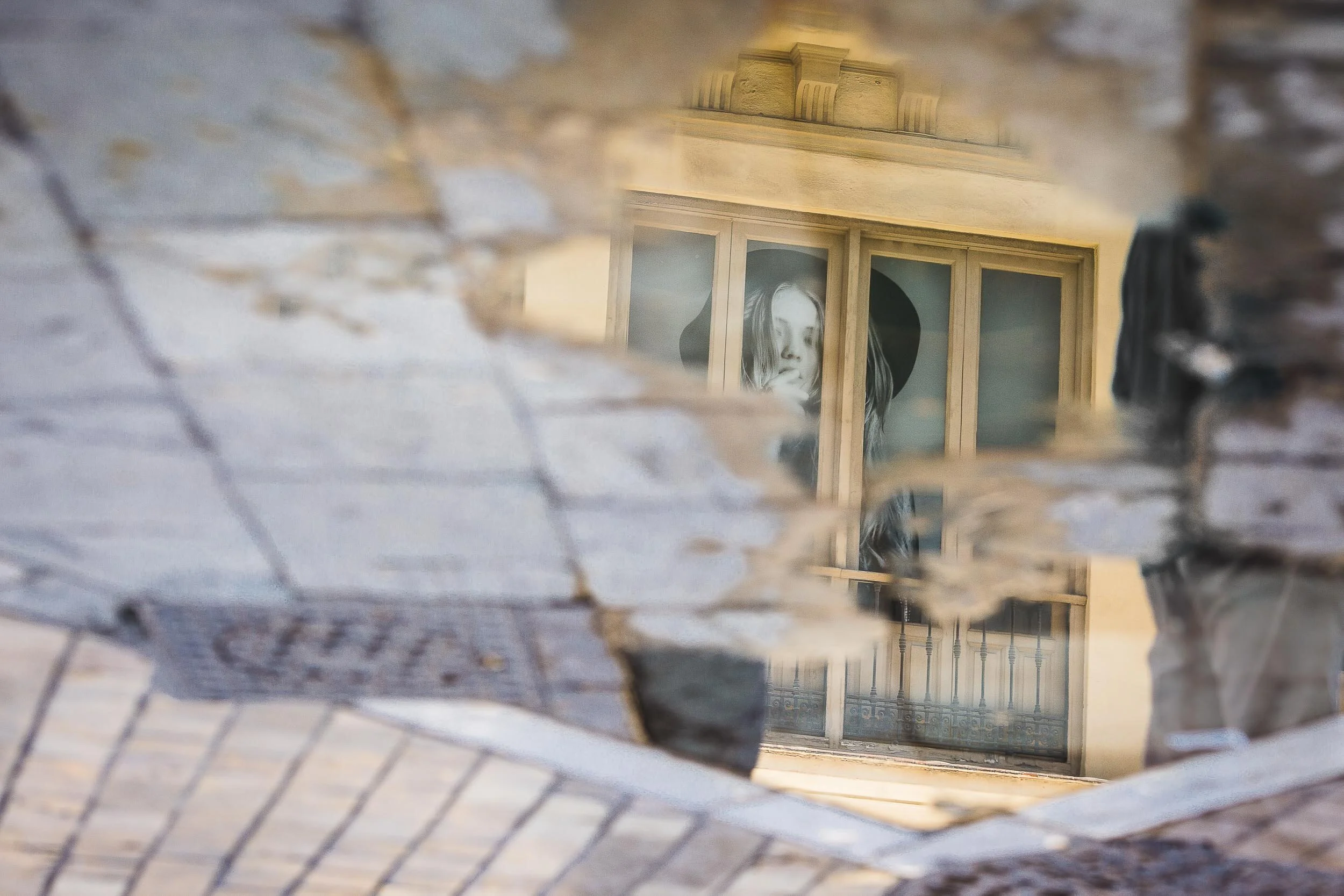 Malaga-reflection-of-woman-in-puddle.jpg