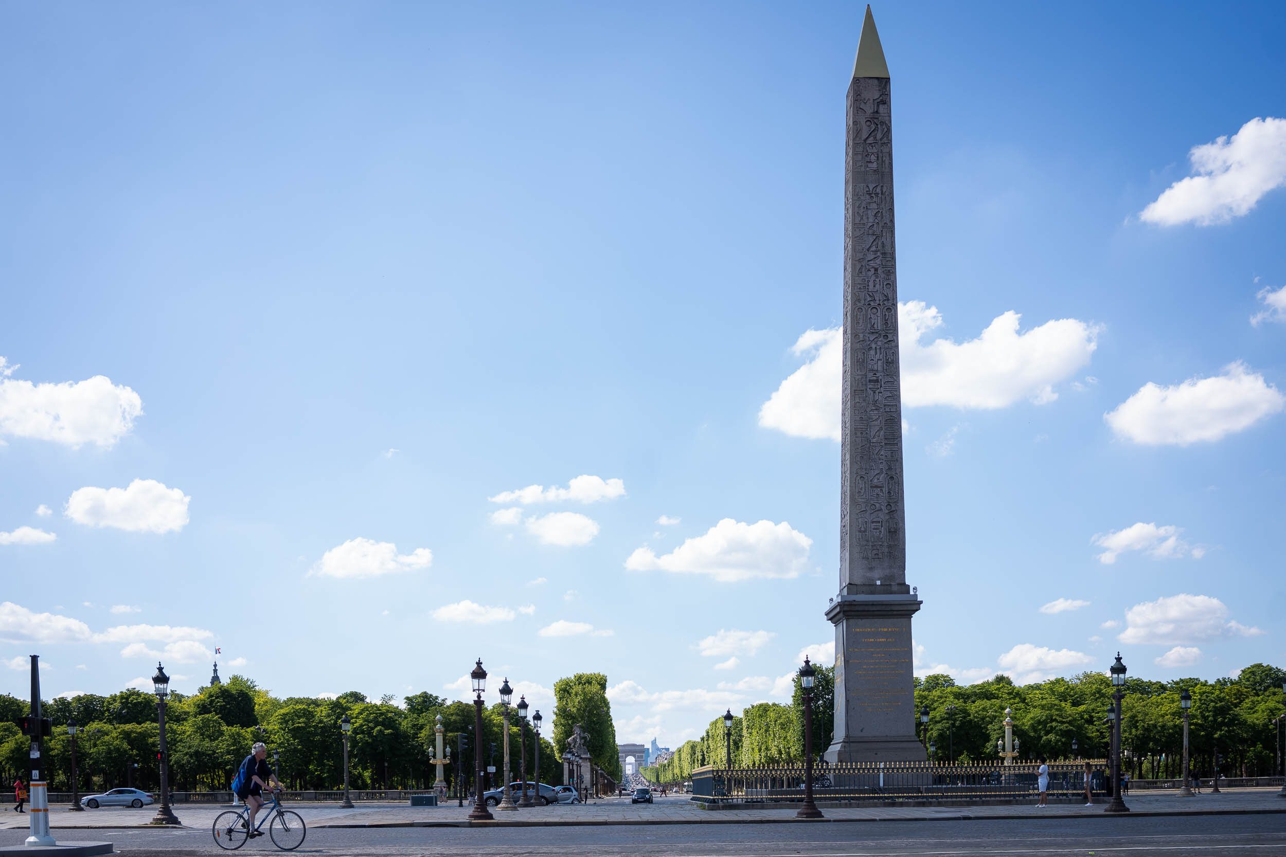 man-cycling-in-front-of-obelisque-paris-13.jpg