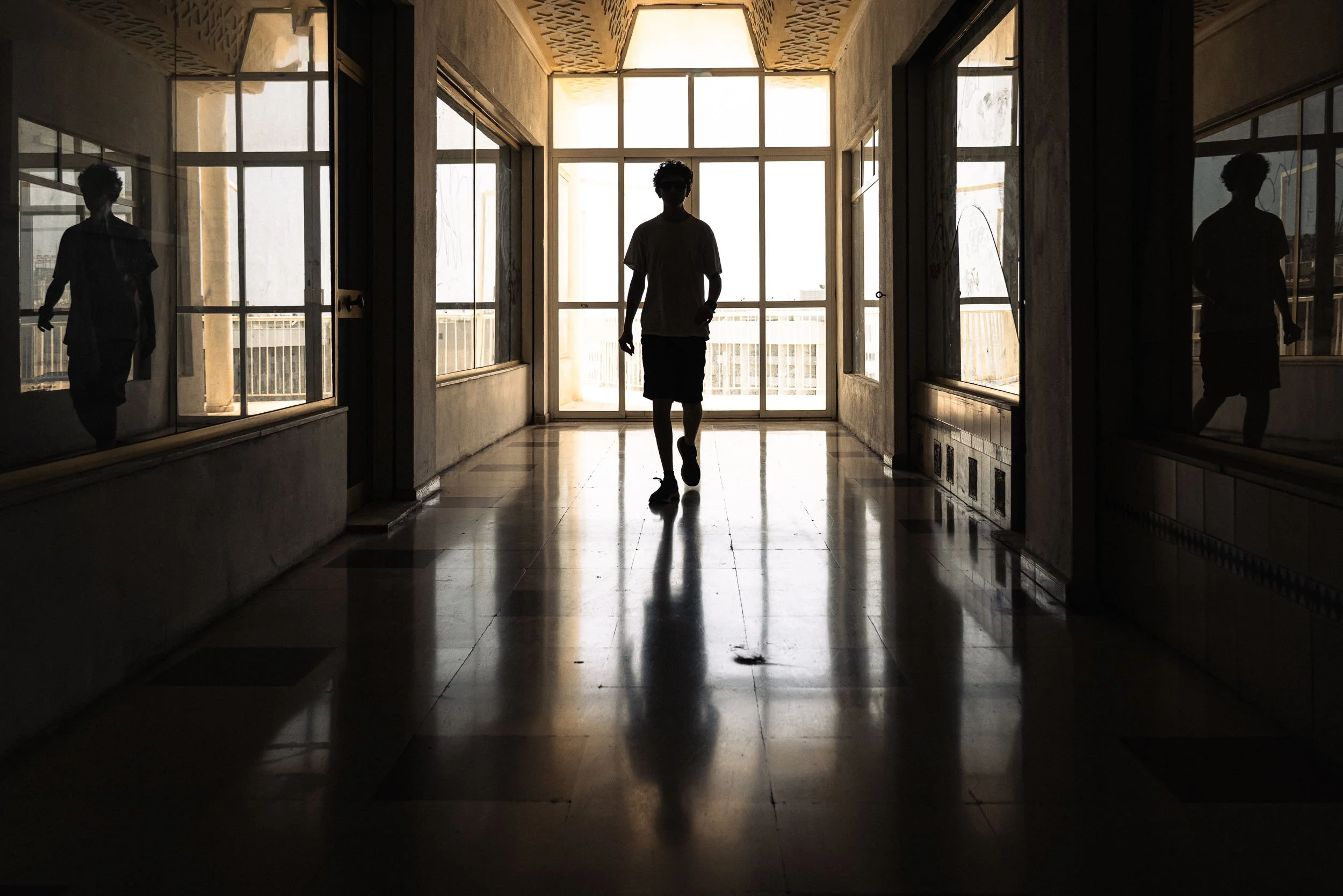 2025-5-reflections-young-man-corridor-merja-varkemaa.jpg