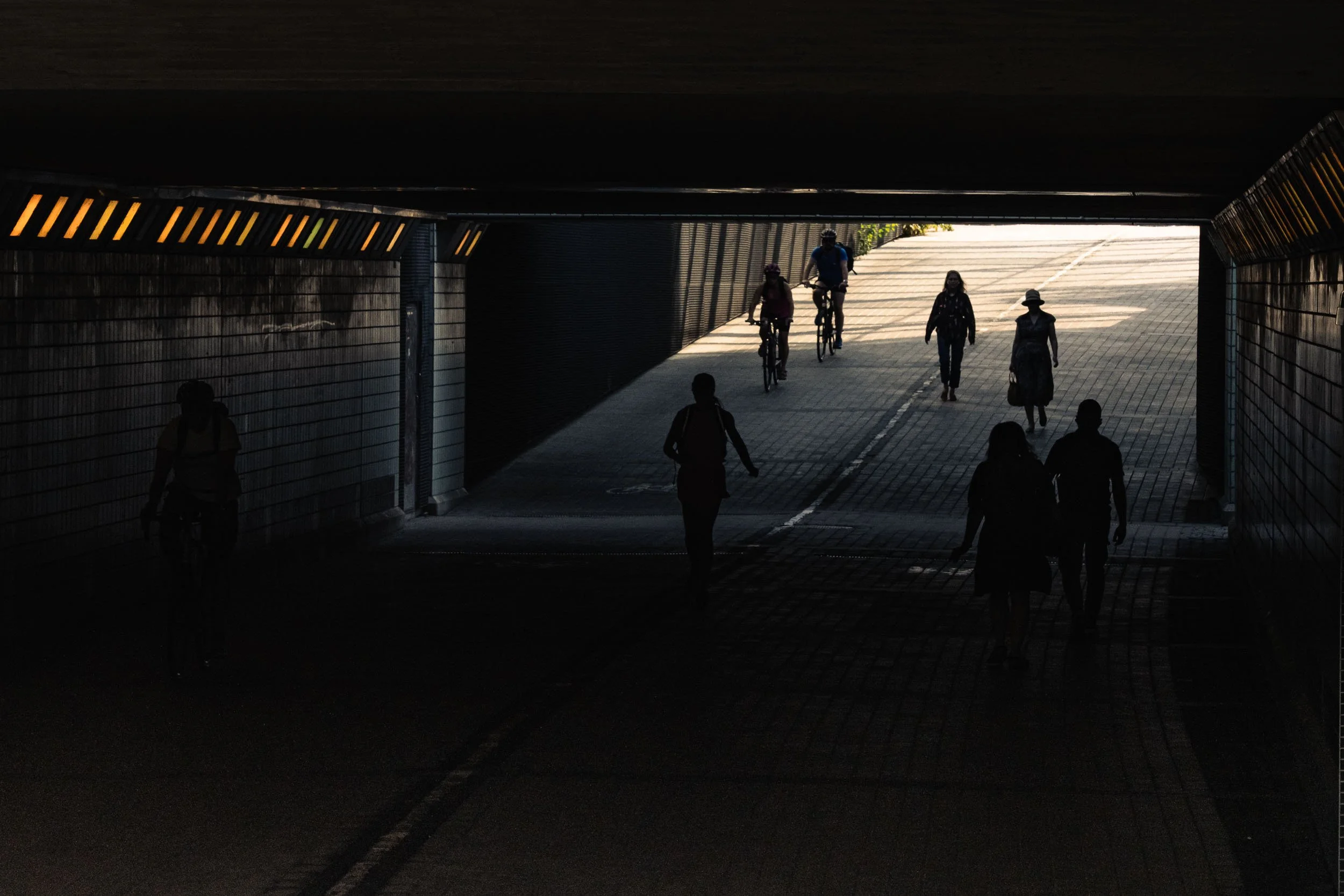 2025-15-people-walking-into-tunnel-merja-varkemaa.jpg