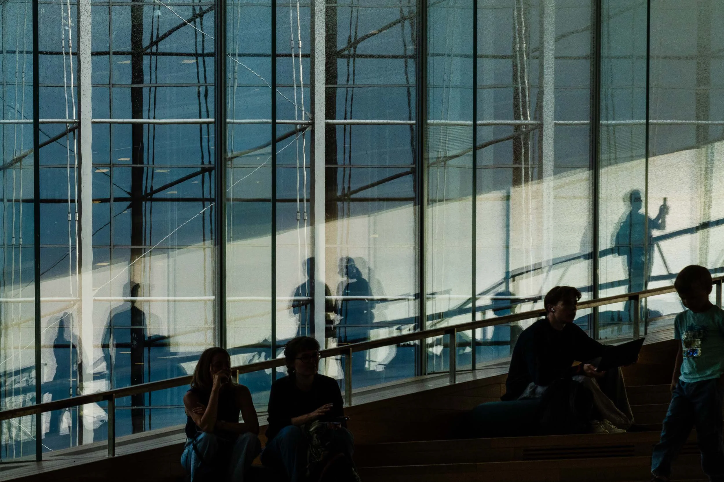2025-19-people-reflecting-on-window-helsinki-merja-varkemaa.jpg