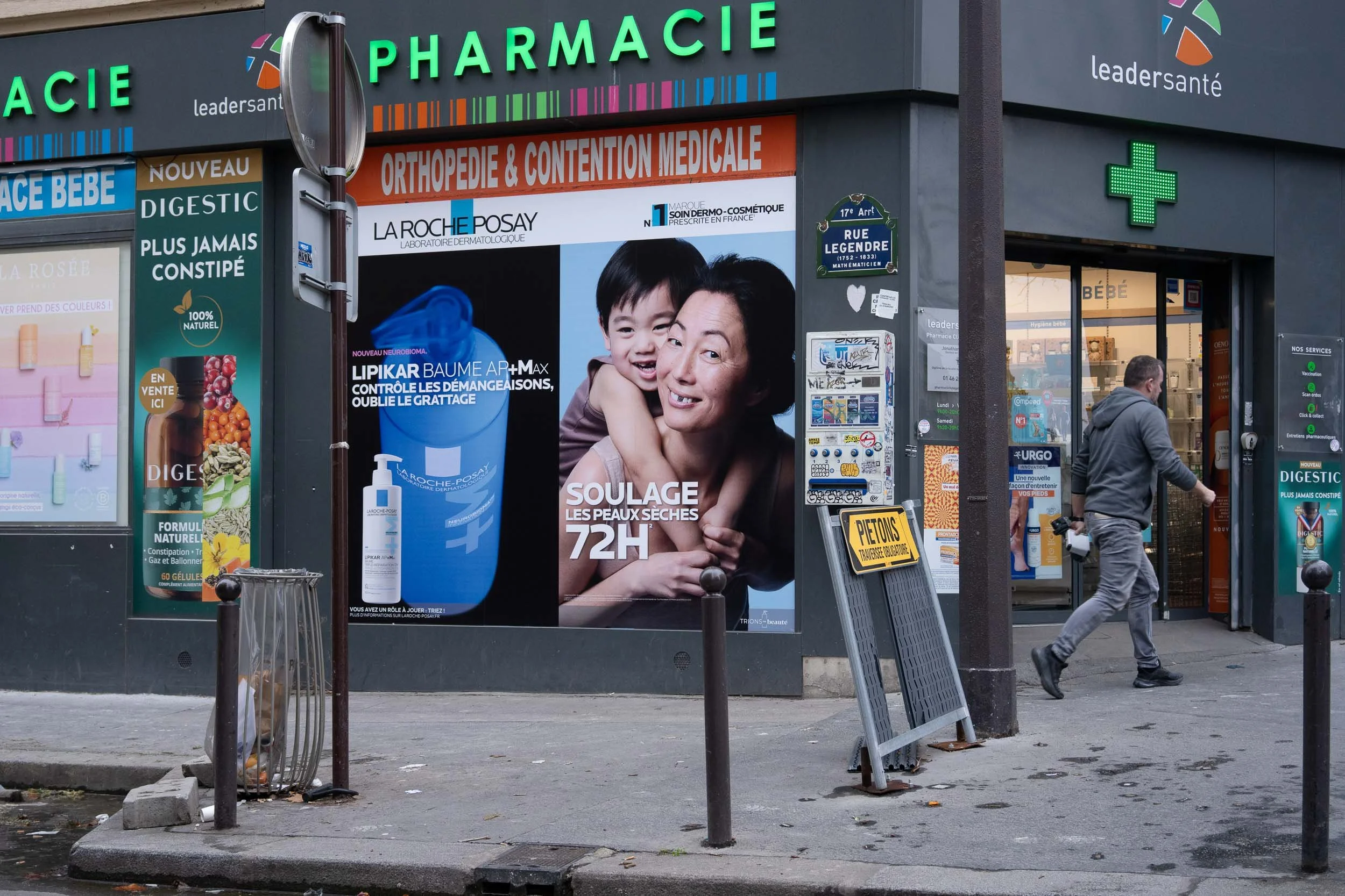 9-graffiti on an advertisement-street in paris-merja varkemaa photography.jpg