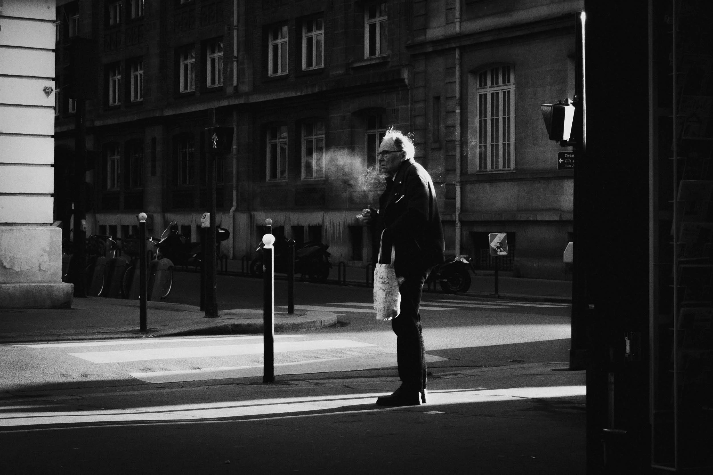 4-man-smoking-in contrasted light-black and white-merja varkemaa photography.jpg