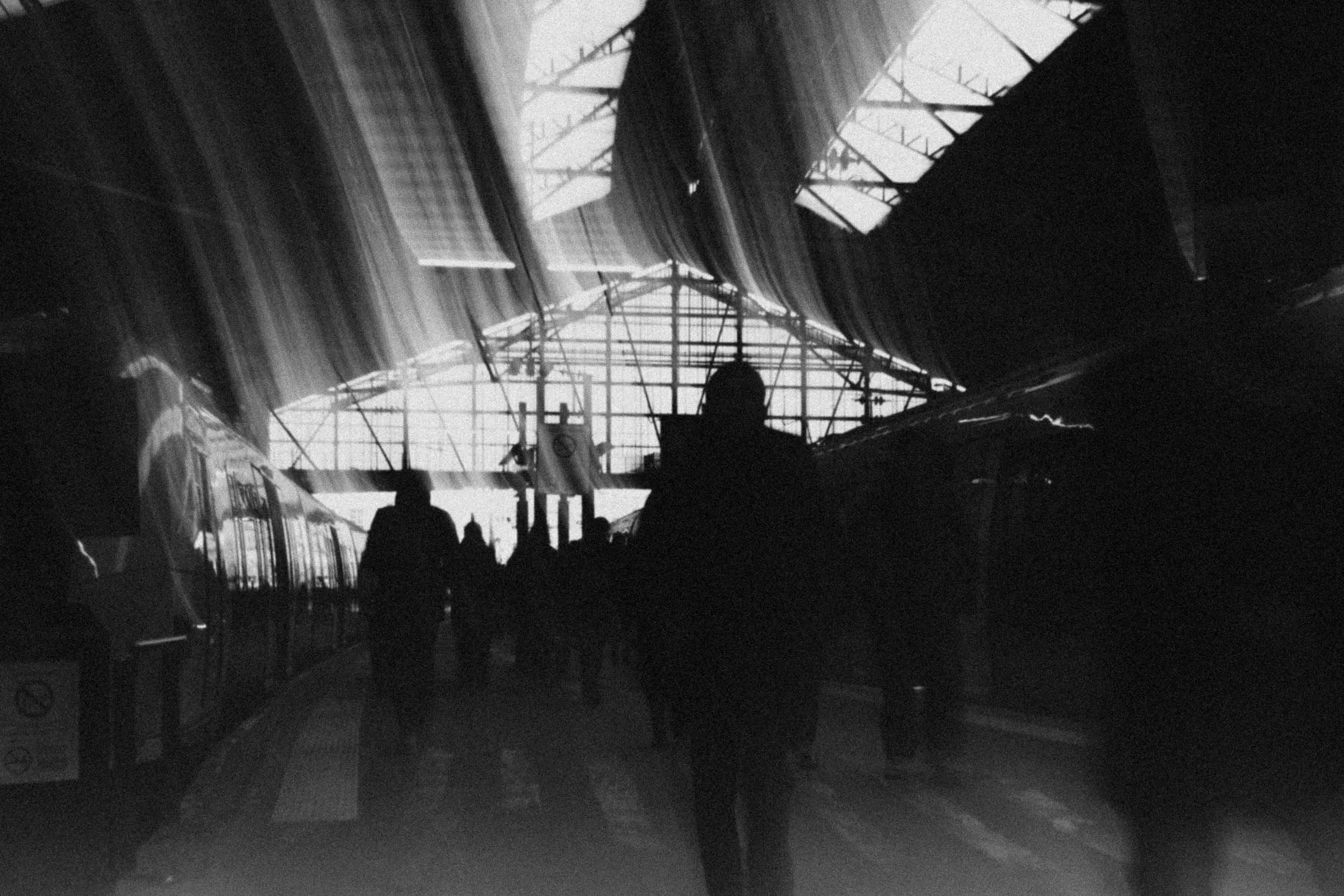 5-people-moving-in slot shutter speed-black and white-merja varkemaa photography.jpg