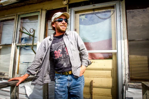 Rodney Kail poses in front of the house in which he has resided in Acadieville, NB, for the past 40 years.