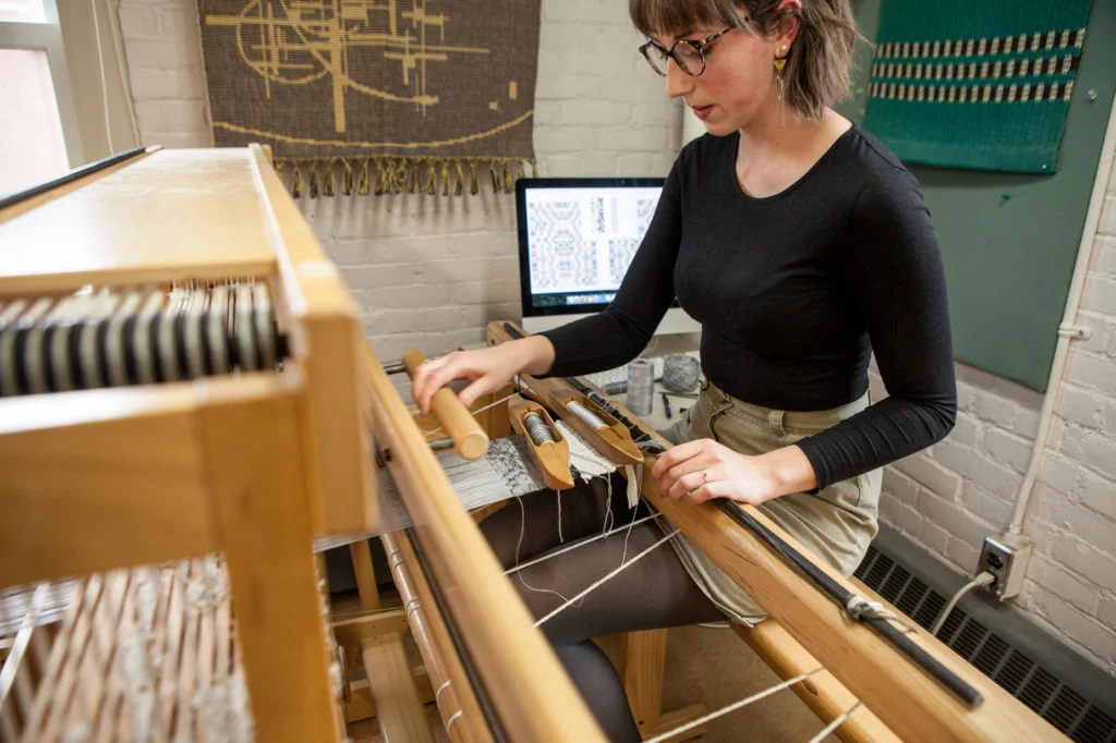 Photo by Bang On Photography - Emily Blair Weaving on CAD Loom