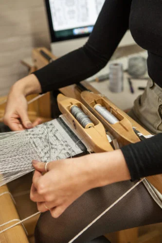 Photo by Bang On Photography - Emily Blair Weaving on CAD Loom
