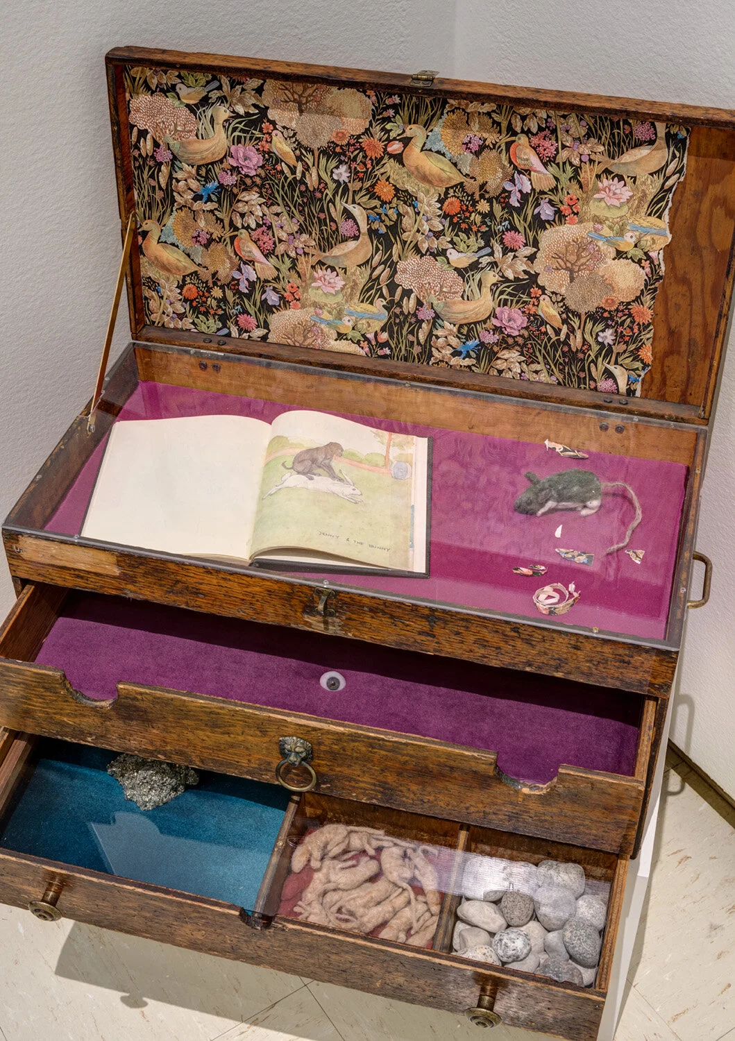 Laura Vickerson, Softly, 2019, antique child’s dress and booties, wool fleece and felt, dried bouquet of lily of the valley, cast beeswax dolls hands, found branch, drawing. Installation shot, Fairy Tails , Owens Art Gallery, 10 January to 1 April 2020. Photo: Roger Smith