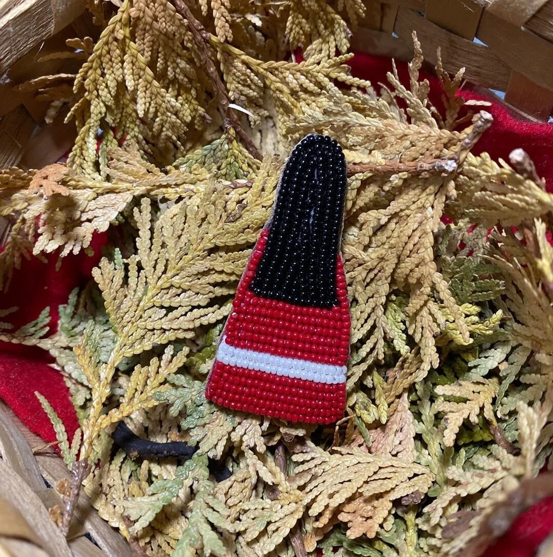 Missing and murdered Indigenous women and girls pin and photo by Alexa Metallic.