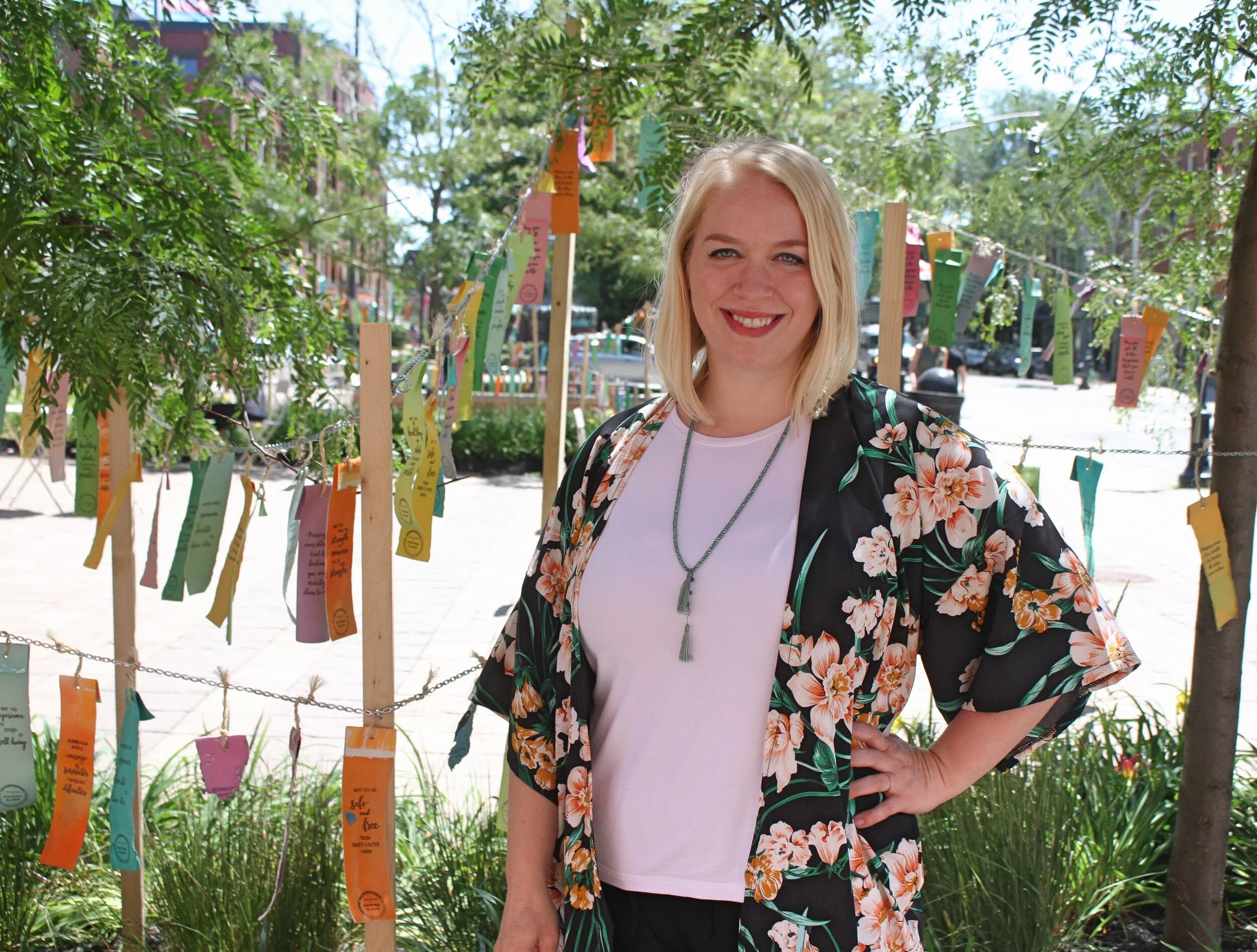 Katrina Sade stands in front of her art installation, Weathergrams for Good . (Photo by Jerry-Faye Flatt)