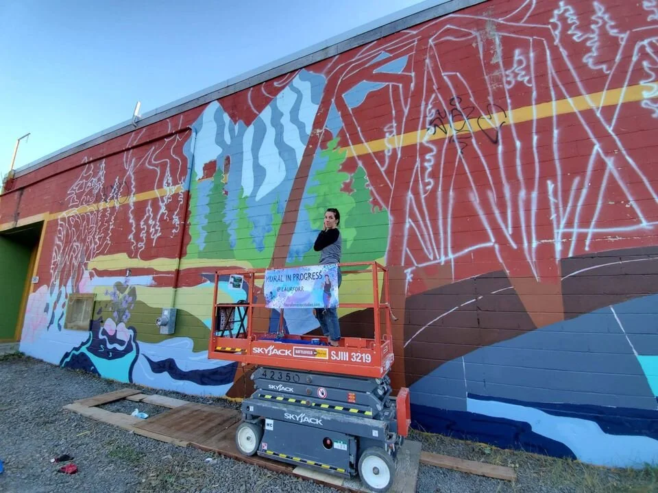 Laura Forrester’s progress on her mural for FLOURISH Festival. (Photo credit: Flourish Festival’s Facebook)