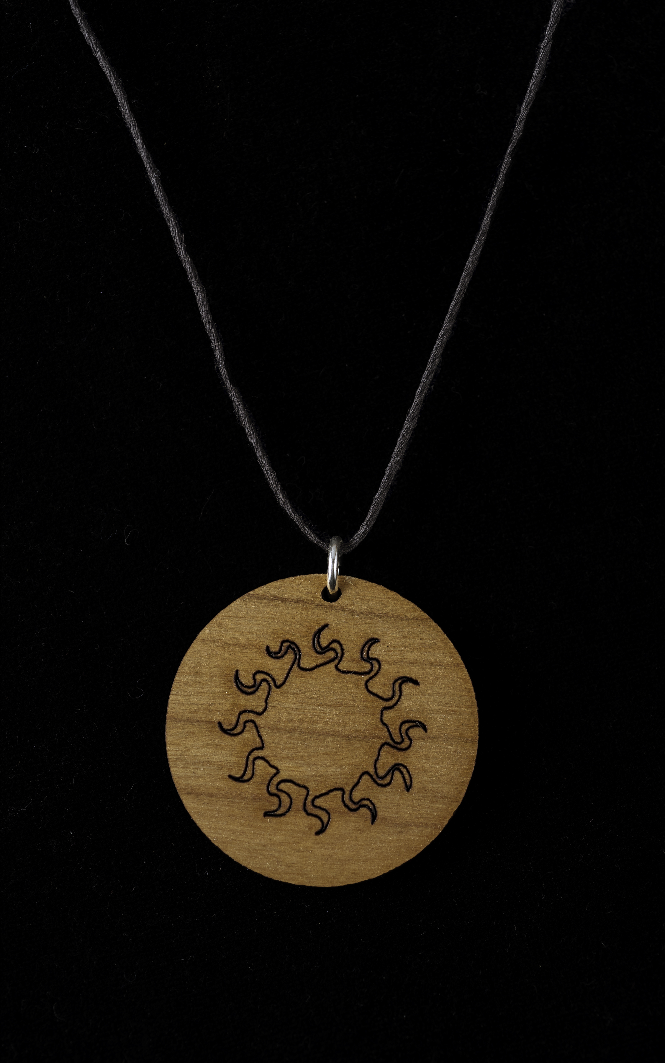 Laser engraved wood blazing sun necklace