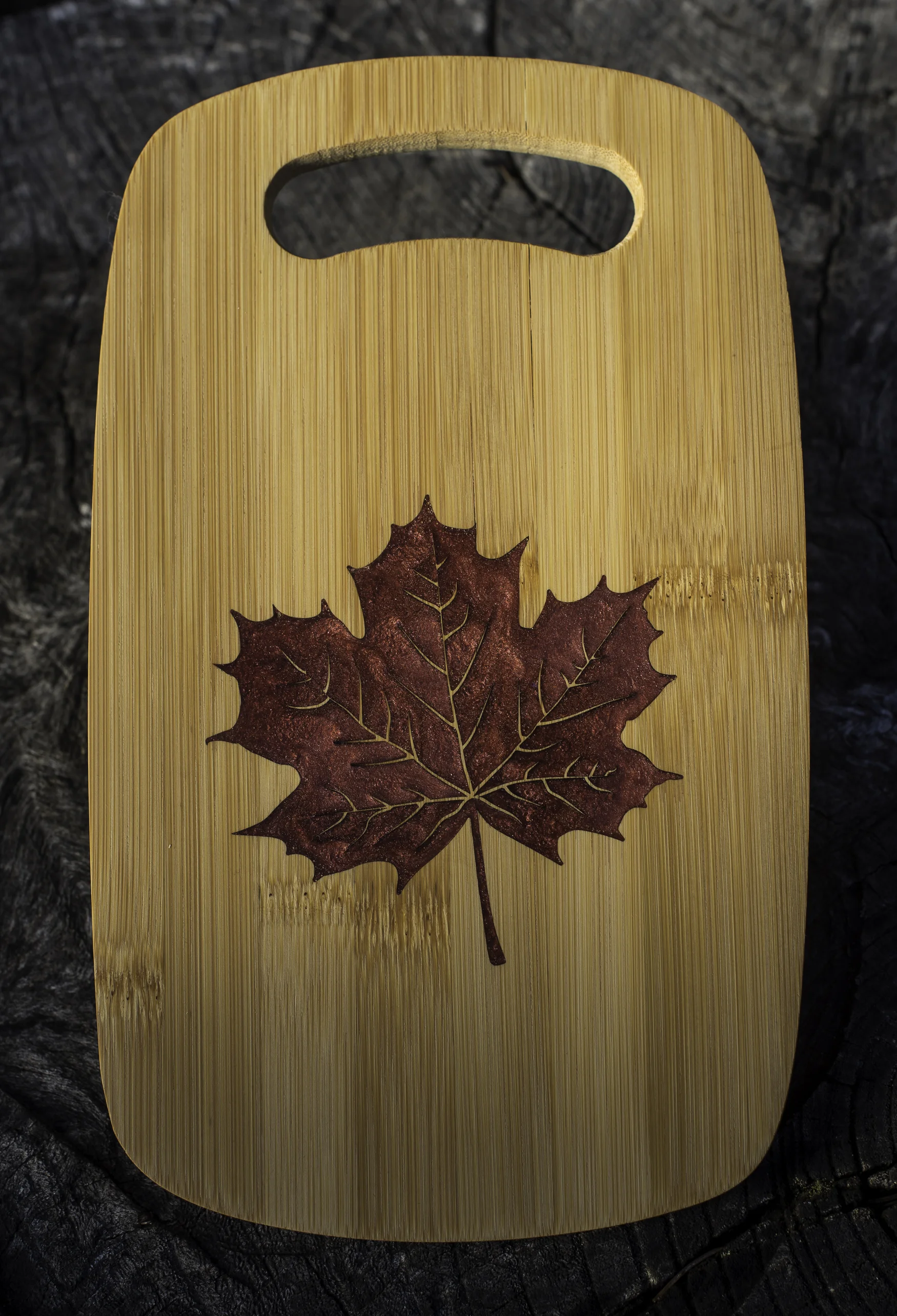 Laser engraved burgundy epoxy filled maple leaf custom cheese board
