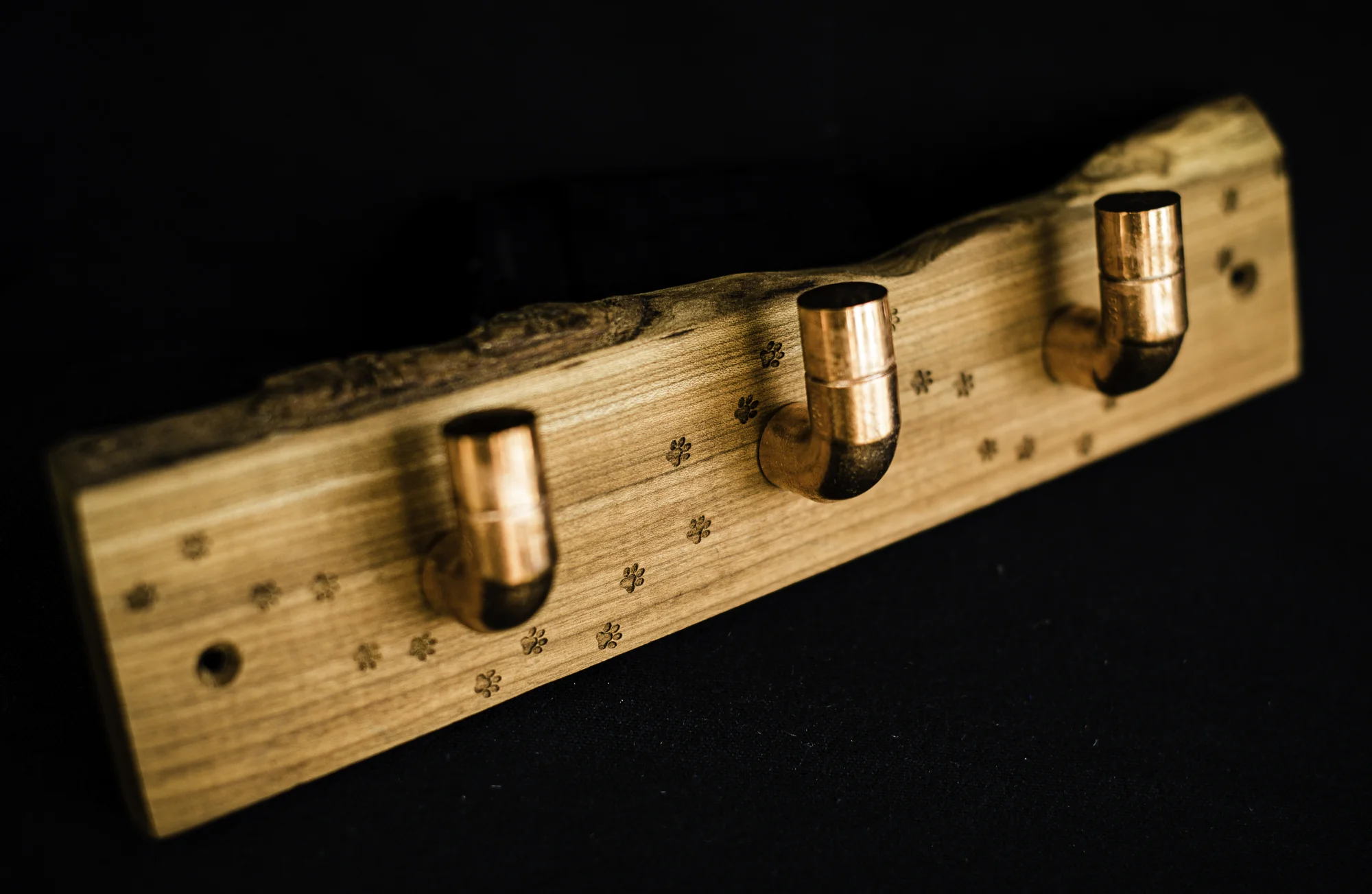 Three copper hooks on paw print laser engraved cherry