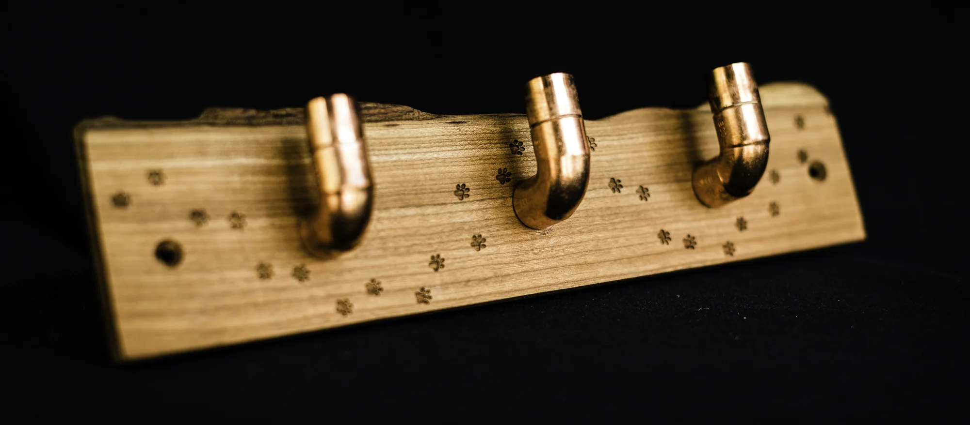 Three copper hooks on paw print laser engraved cherry