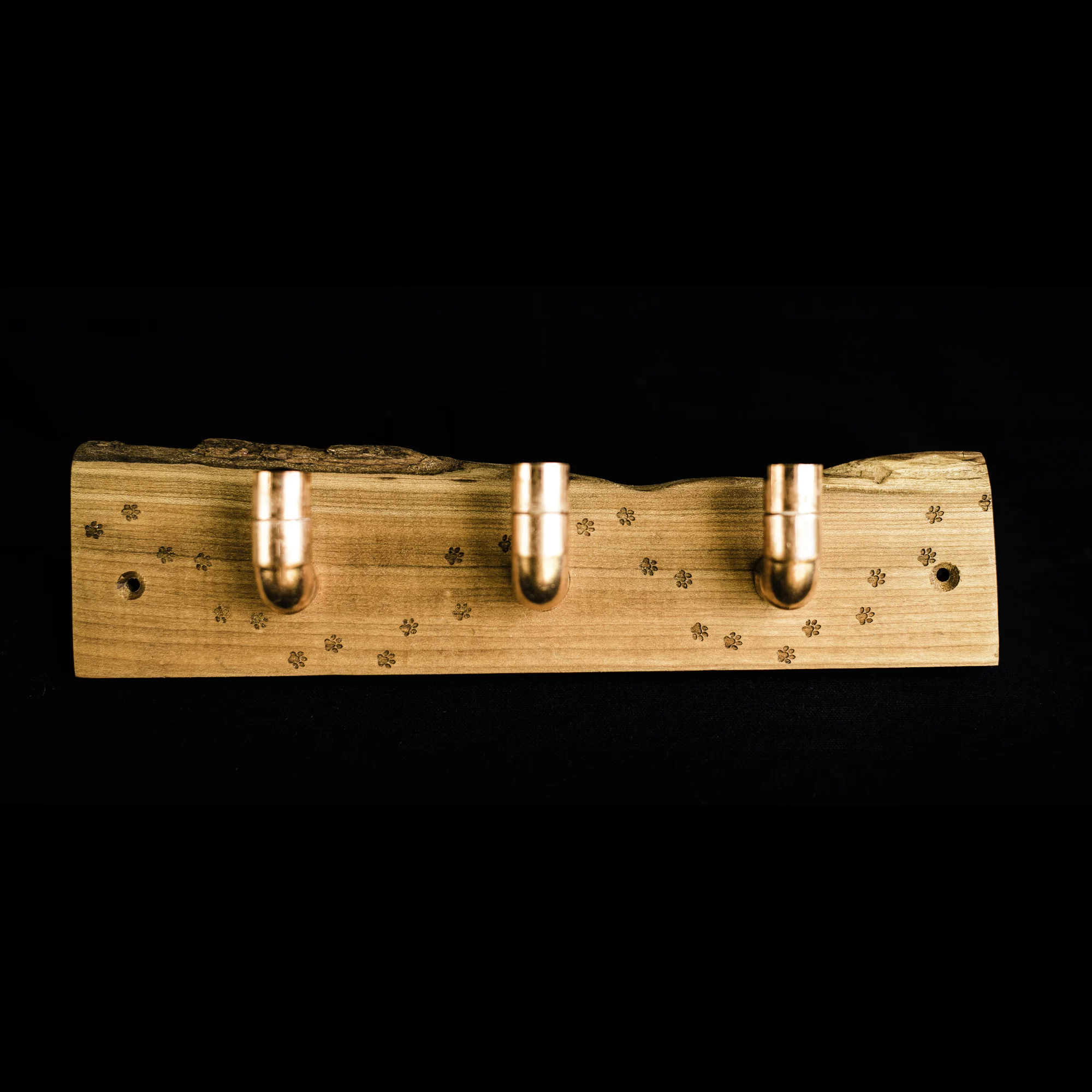 Three copper hooks on paw print engraved cherry