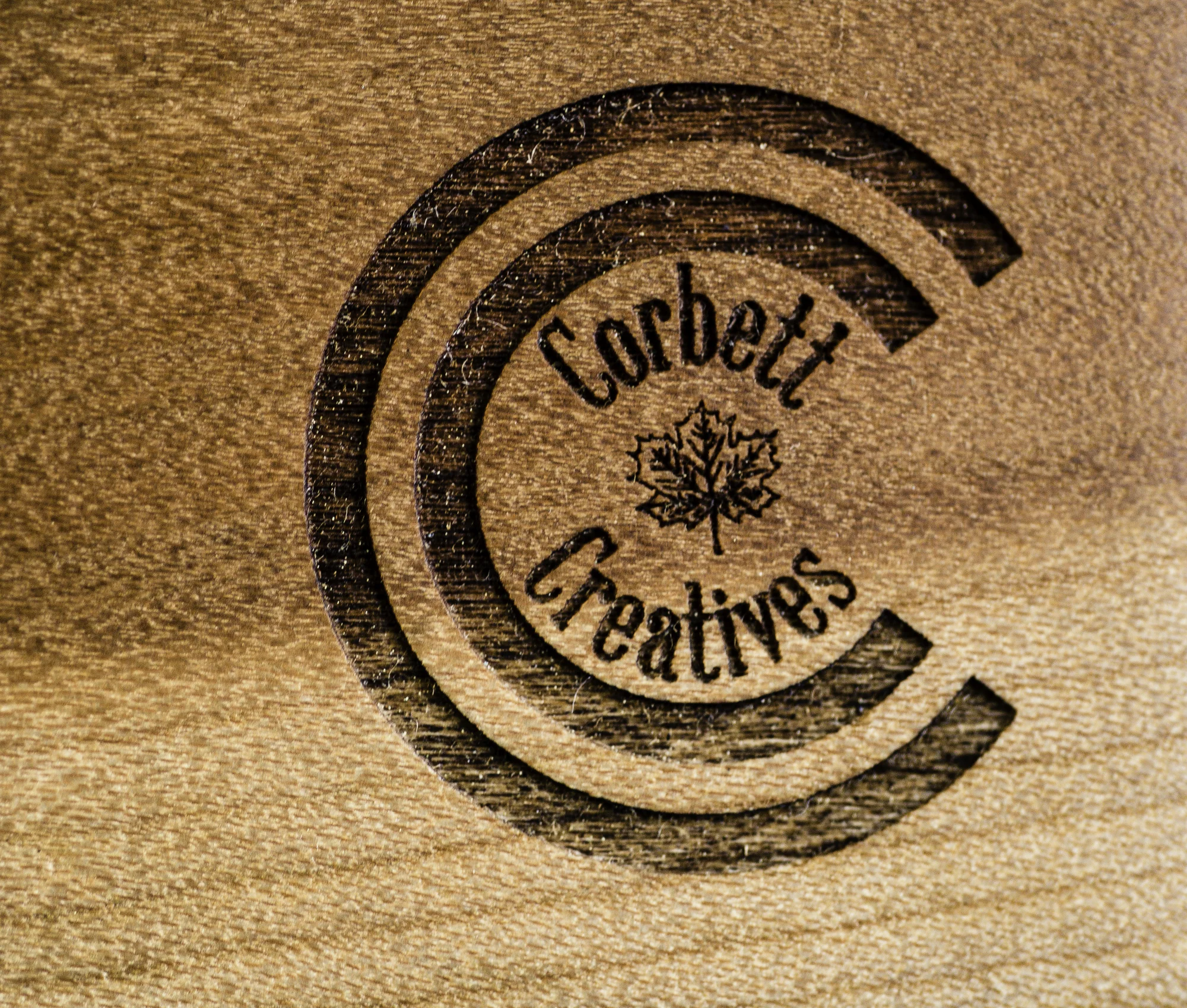Corbett Creatives custom laser engraved logo