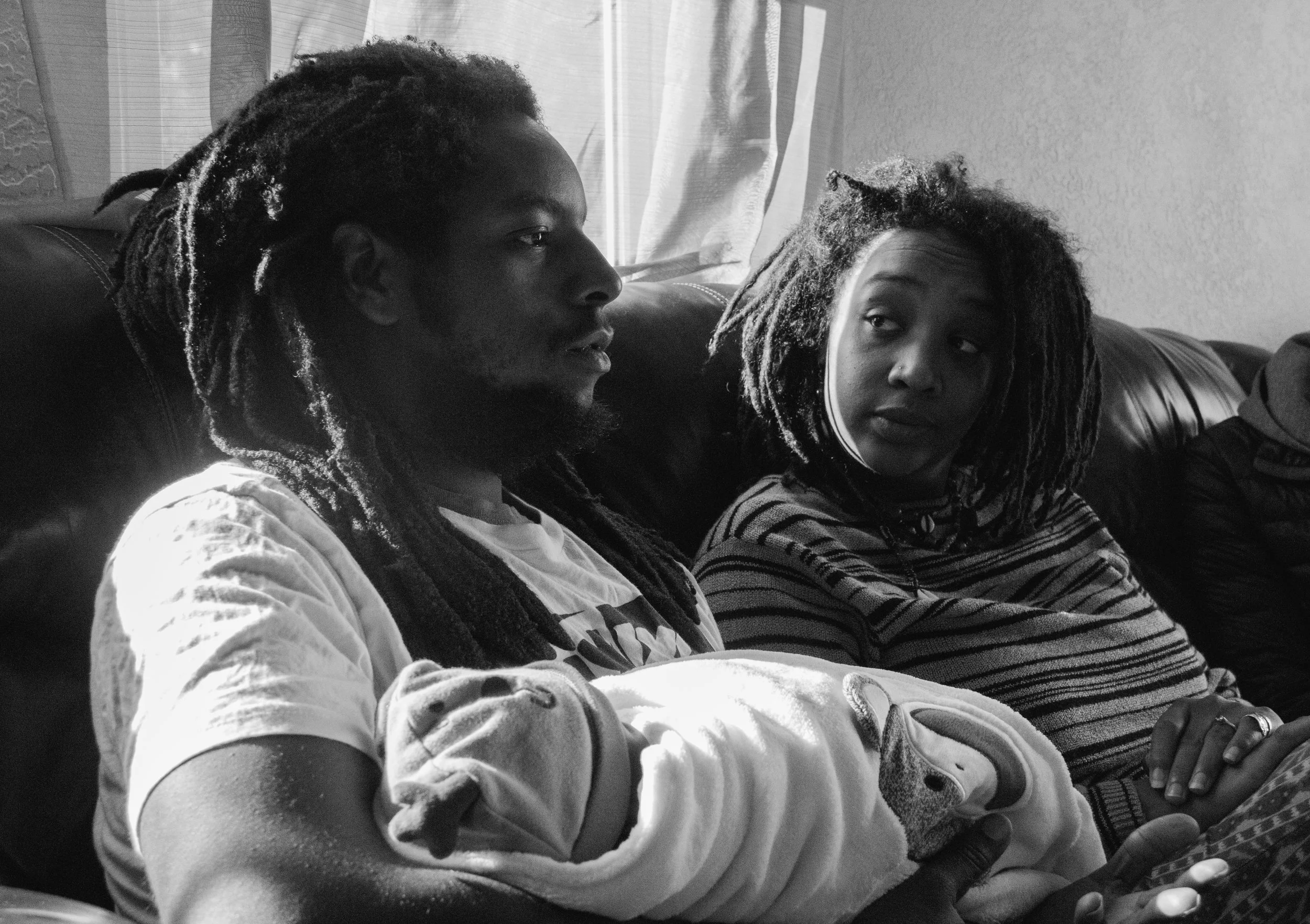 From left to right, Najee and Omi with their child Niajee — Photo by Jesse Sutterley