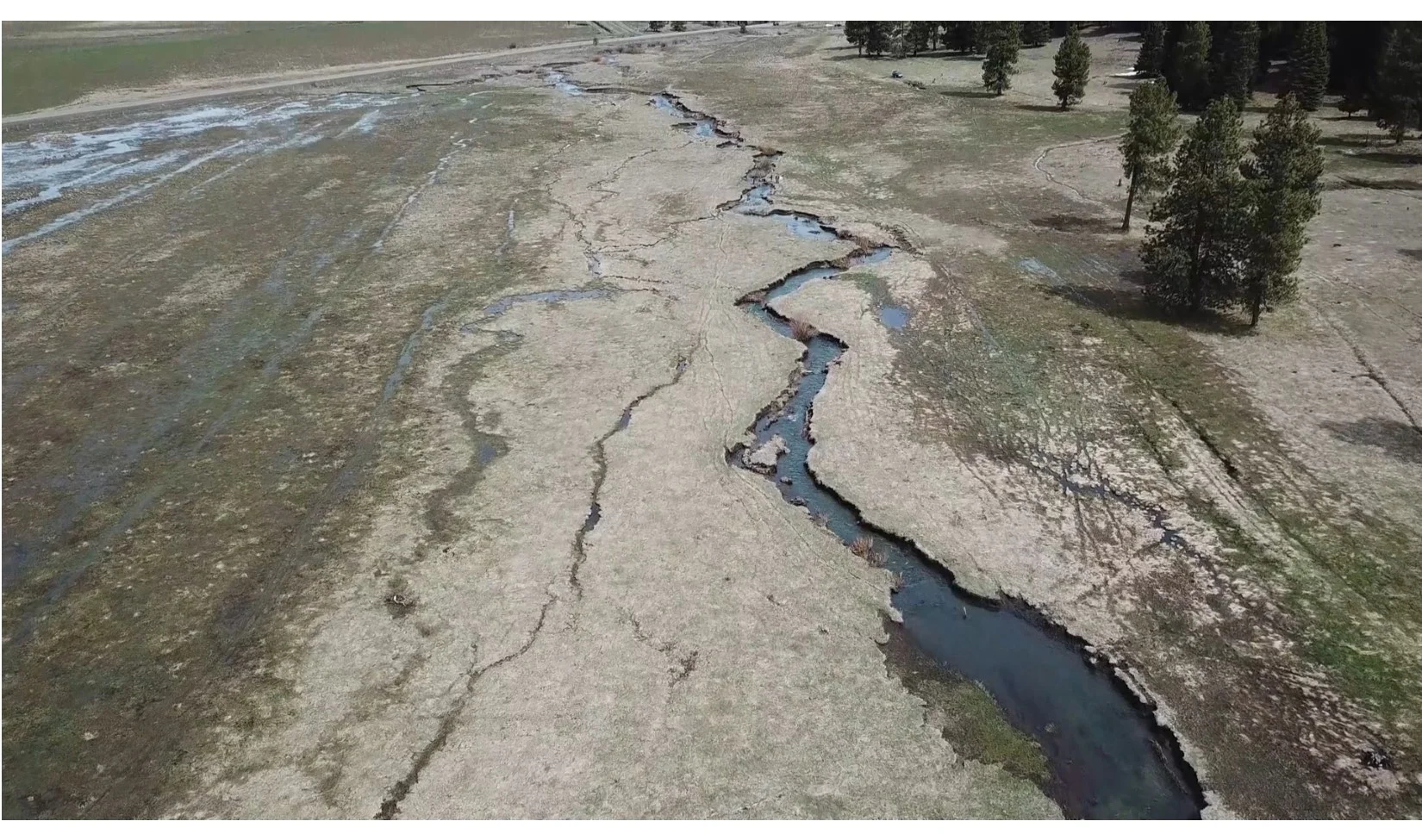 Aerial imagery from the early spring 2019 shows old cattle paths (Right of creek) as well as old water diversions in parallel channels (Left of the creek). Picture by Mark Lunn Photography