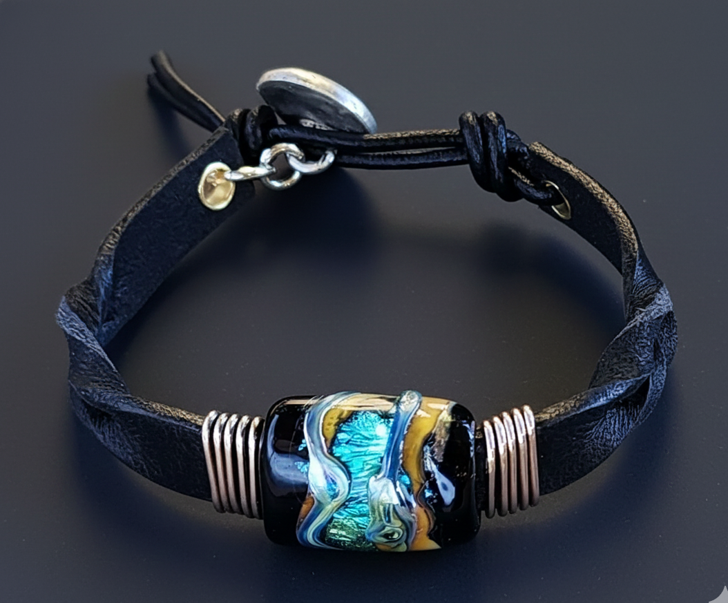 Twisted black leather cuff bracelet with a square Infused Glass memorial bead, honoring both people and pets.