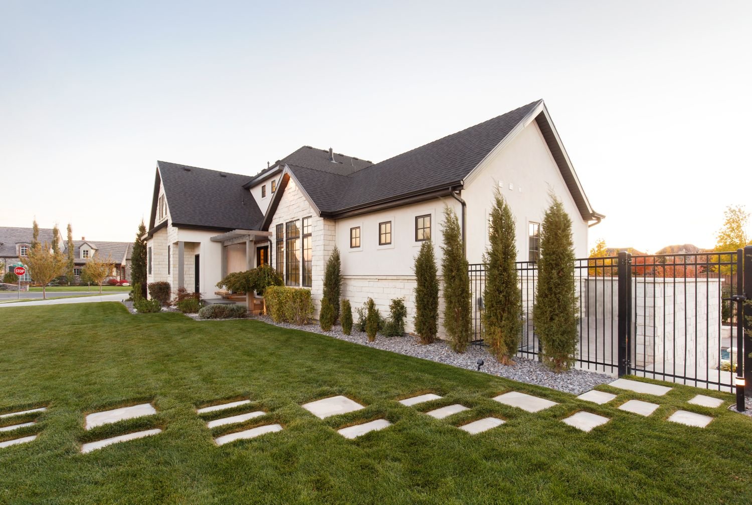 Residential landscape maintenance with manicured lawn and stepping stone walkway in Salt Lake City, UT