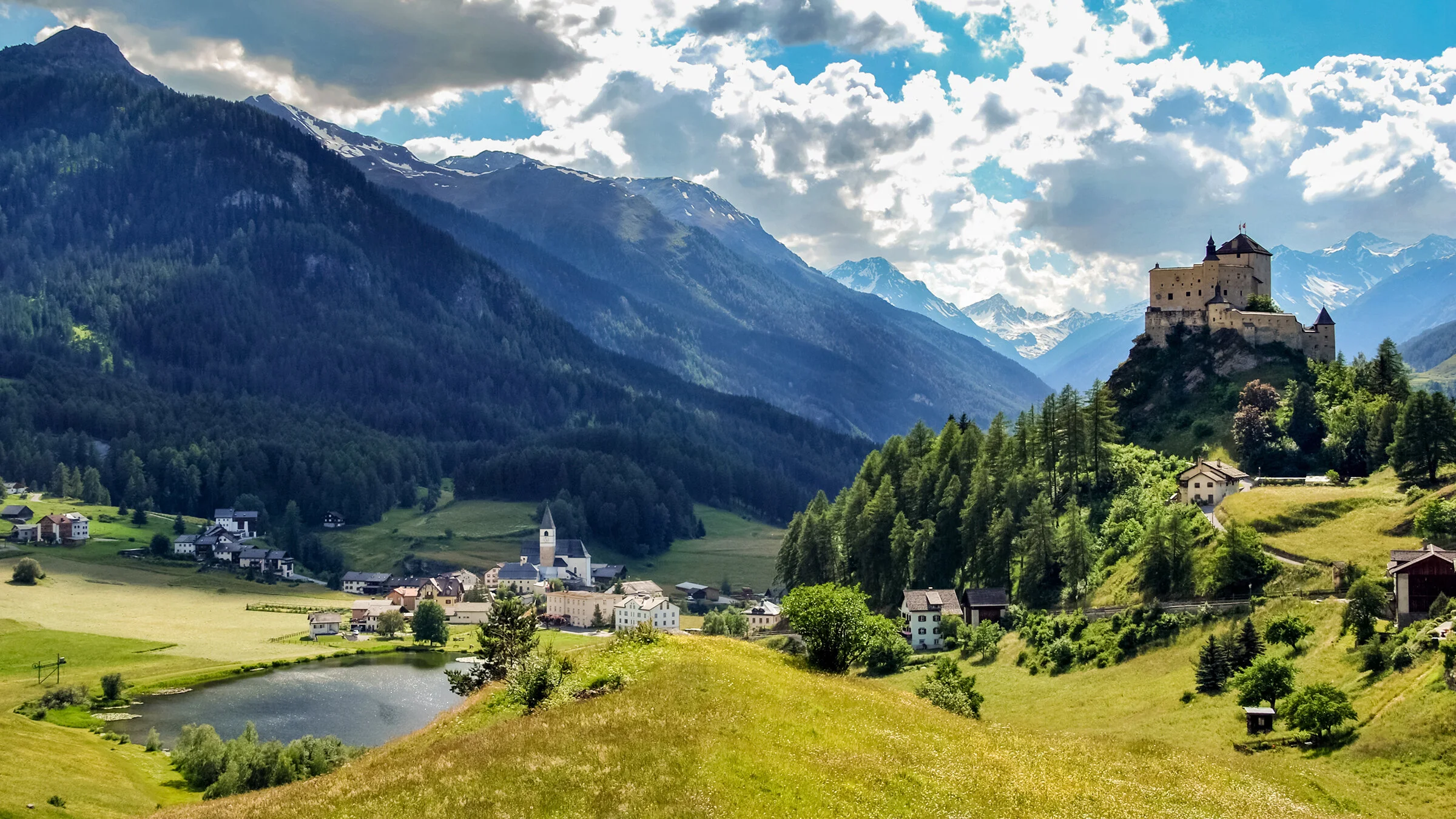 The tiny Swiss village of Tarasp beneath the majestic Tarasp Castle in the Engiadina Bassa (Lower Engadine).