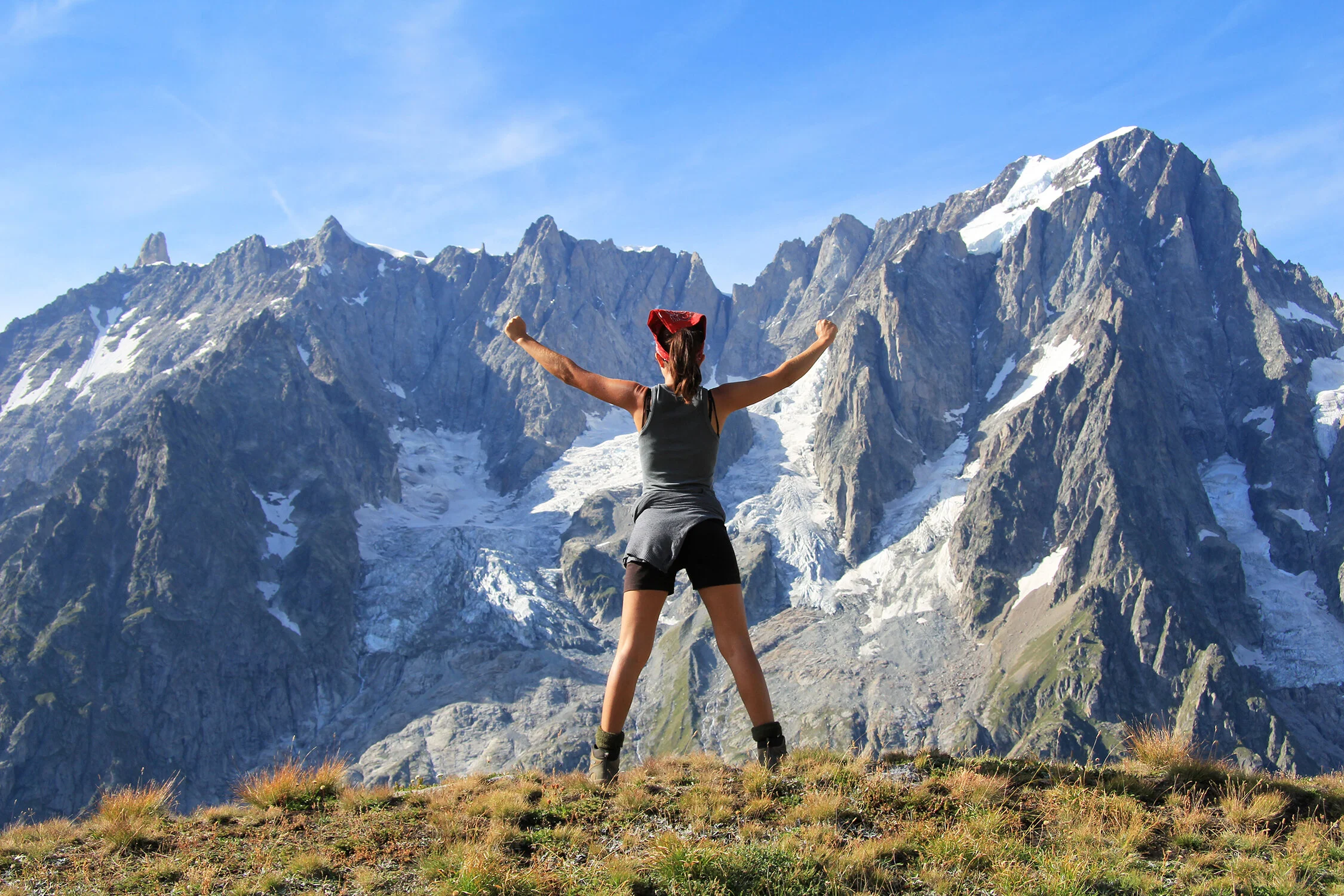 Celebrating life on the TMB in front of the Grandes Jorasses in the Val Ferret, Italy.