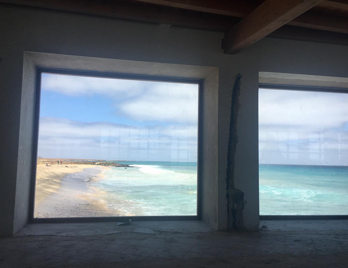 New windows along the left wall of the restaurant, with stunning views down the beach...