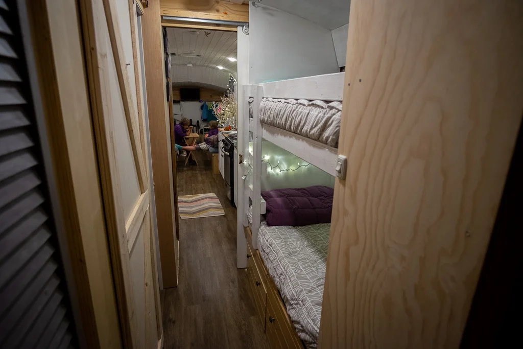 Looking forward from the master bed, through the hall, into the kitchen and living area
