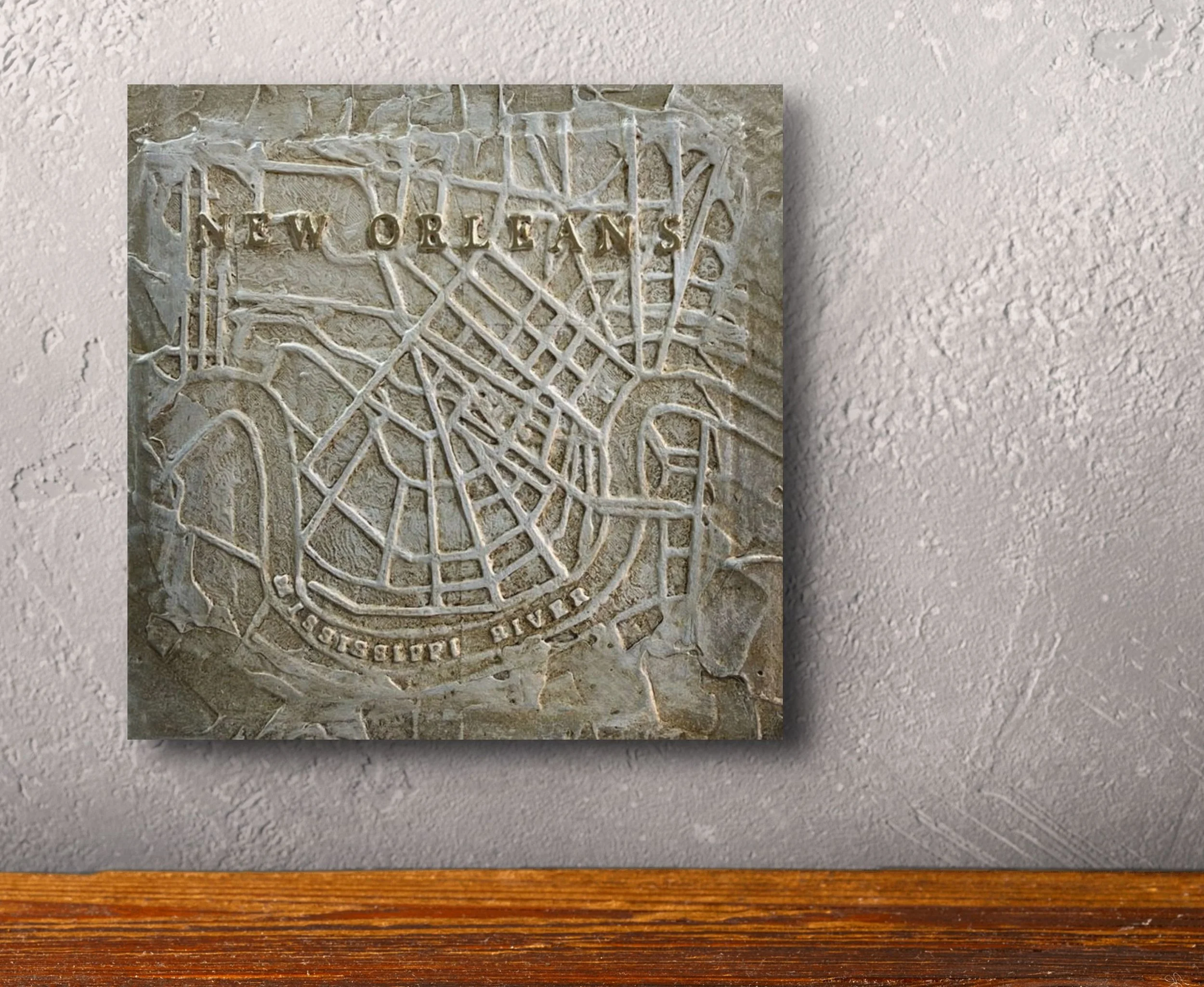 City Of New Orleans relief map showing raised detail of streets and waterways. Measures 10"x10", signed in gold by John Marc Anderson