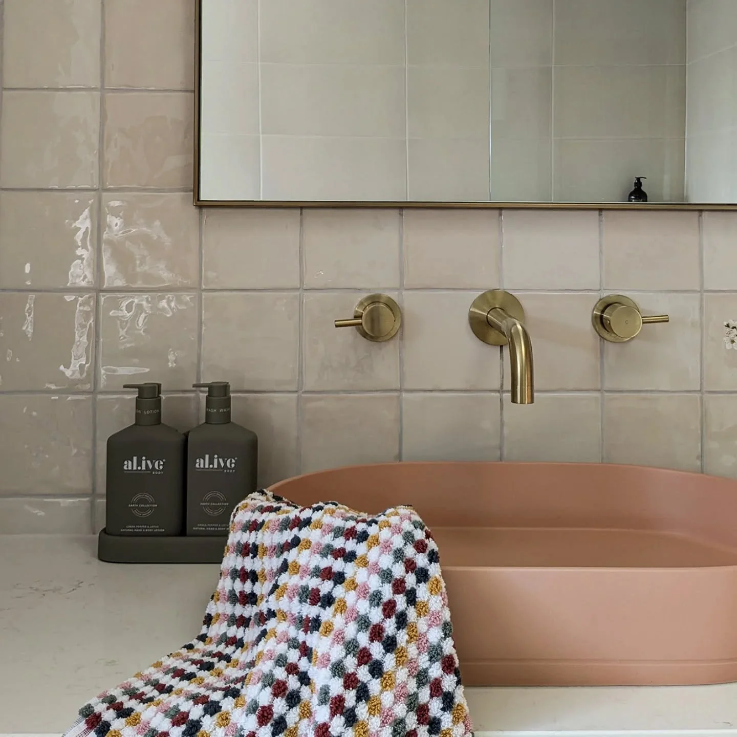 Warm brass + blush tones = the perfect combination for a welcoming bathroom. ⁠
⁠
In this client&rsquo;s space, the brushed brass tapware complements the blush basin and textured tiles, adding warmth and cohesion. ⁠
⁠
The result? A bathroom that feels