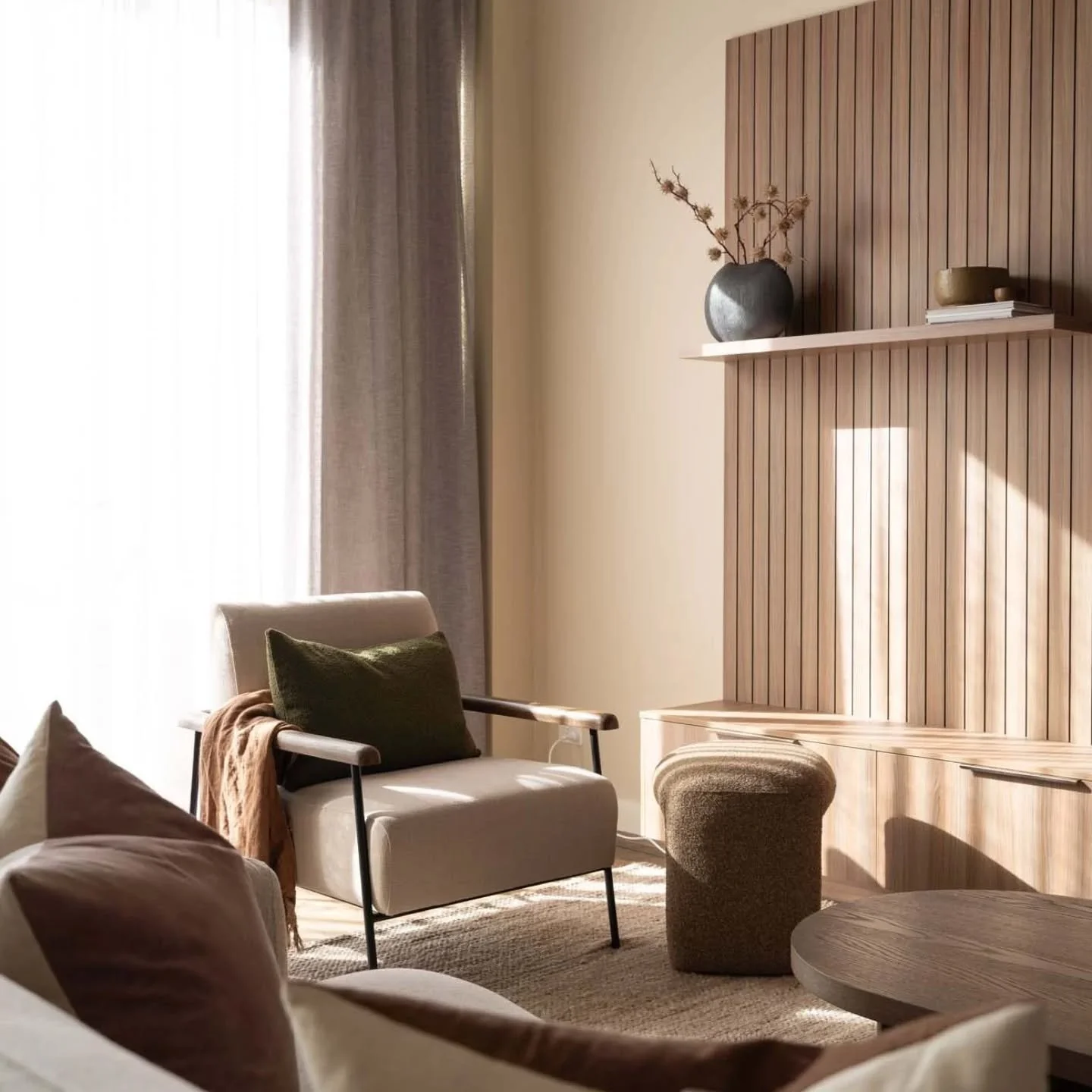 A living space that you just don't want to leave. ⁠
⁠
I'm hoping my clients are enjoying their sun dabbled space to relax in together. ⁠
⁠
We worked together to create this warm Japandi, modern organic interior and it came together beautifully. ⁠
⁠
D