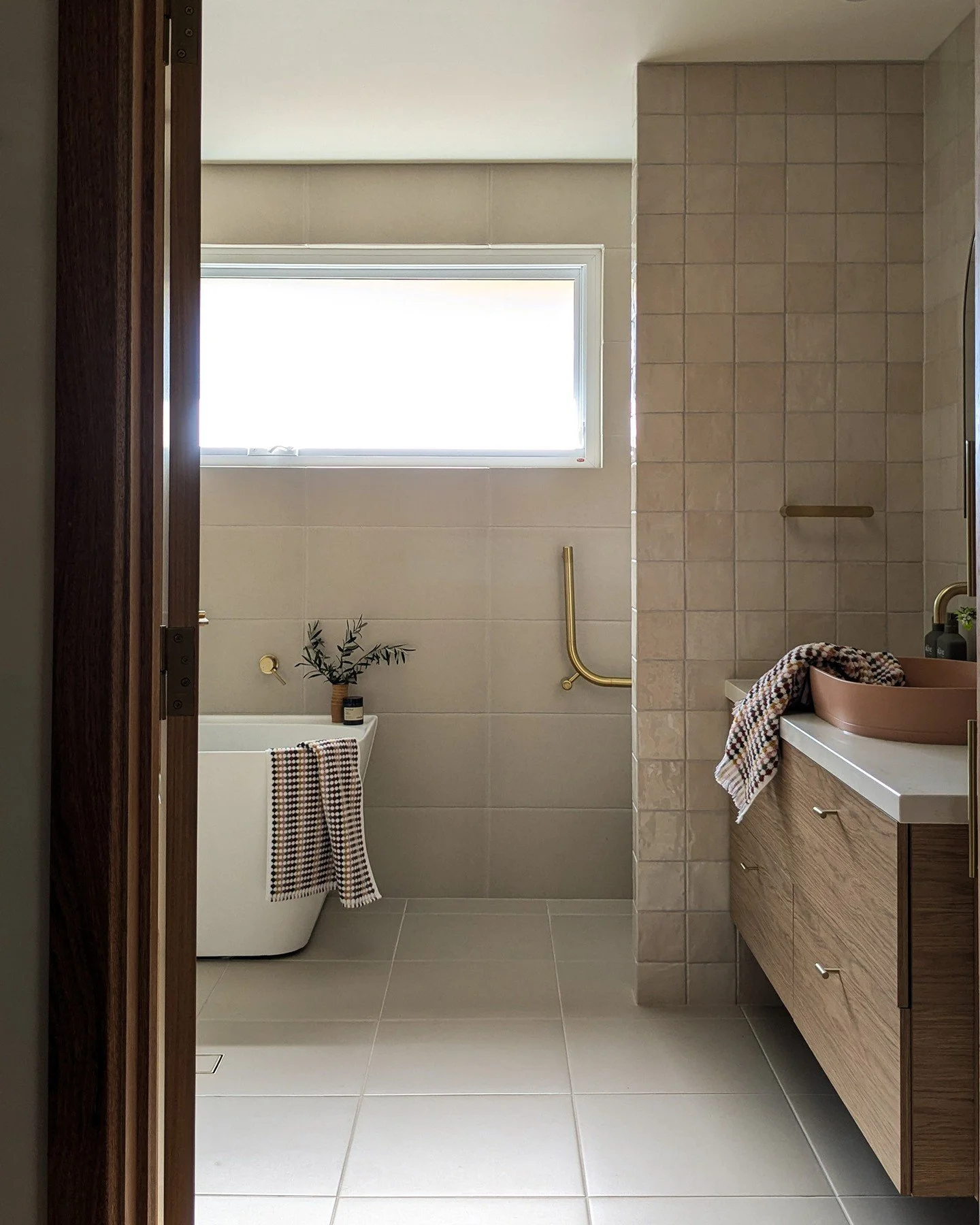 A lot of careful space planning went into this Aberfoyle Park bathroom renovation. ⁠
⁠
We chose to remove some walls to open up the space and bring in more natural light, but we still kept some internal wall to maintain privacy from the toilet as you