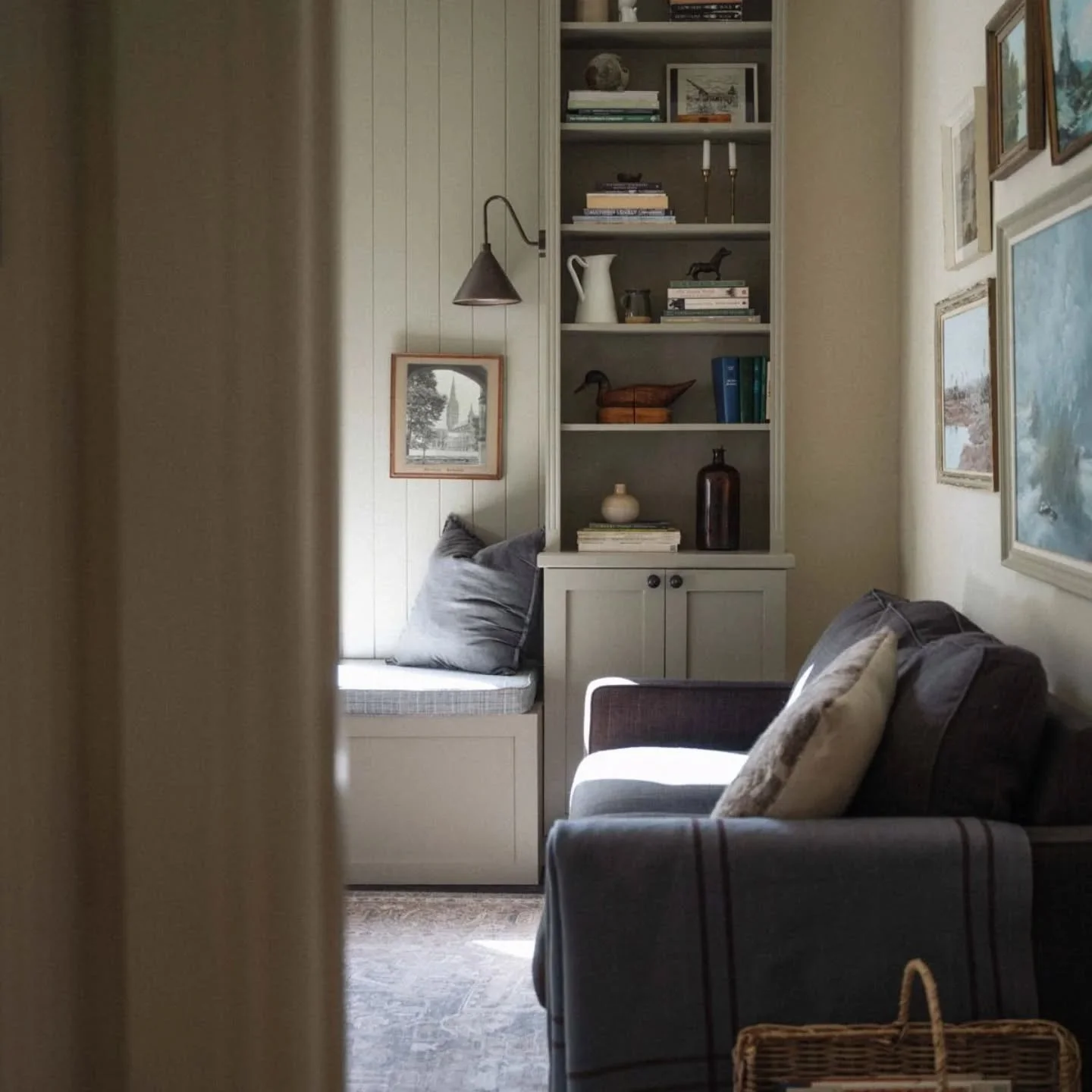 Talk about a welcoming, country home feel. ⁠
⁠
This lounge area was a project my client and I spent considerable time thinking about. ⁠
⁠
We wanted it to feel moody but not too dark. By introducing rich colour in the artworks and sofa, and mixing the