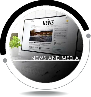 Laptop displaying a news website with a NEWS AND MEDIA overlay