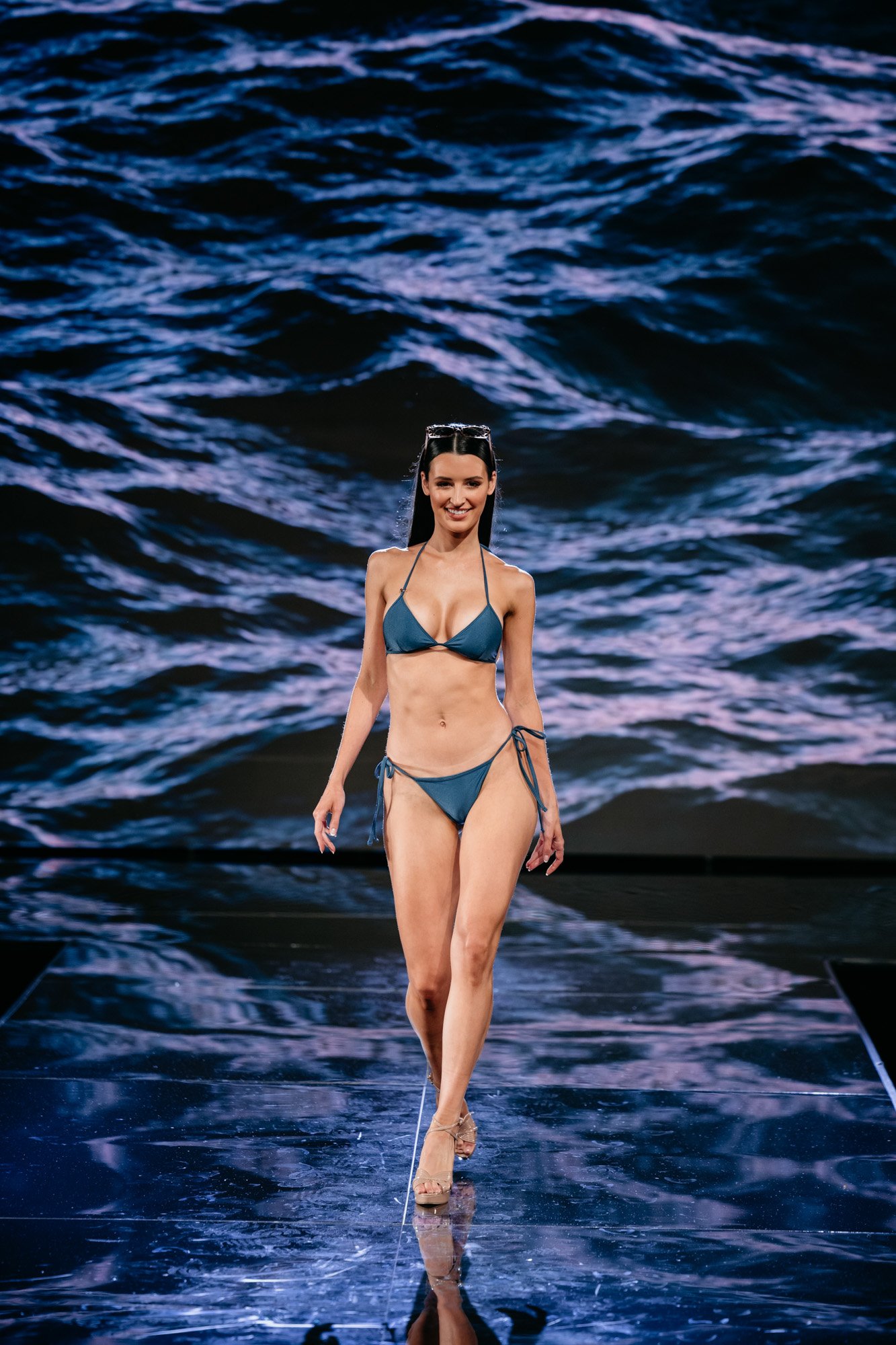 model on runway in bikini
