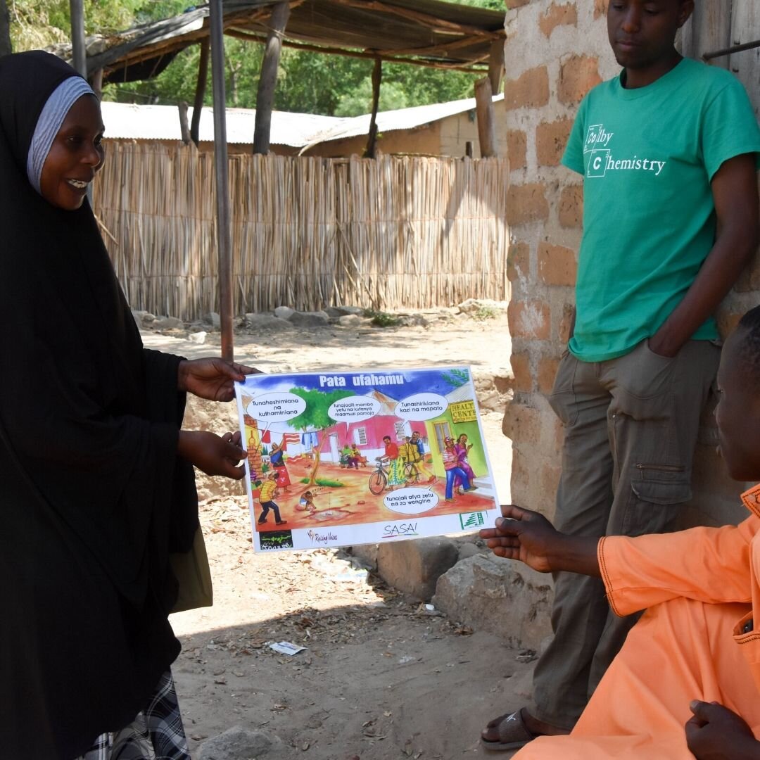 Woman presenting poster on gender empowerment