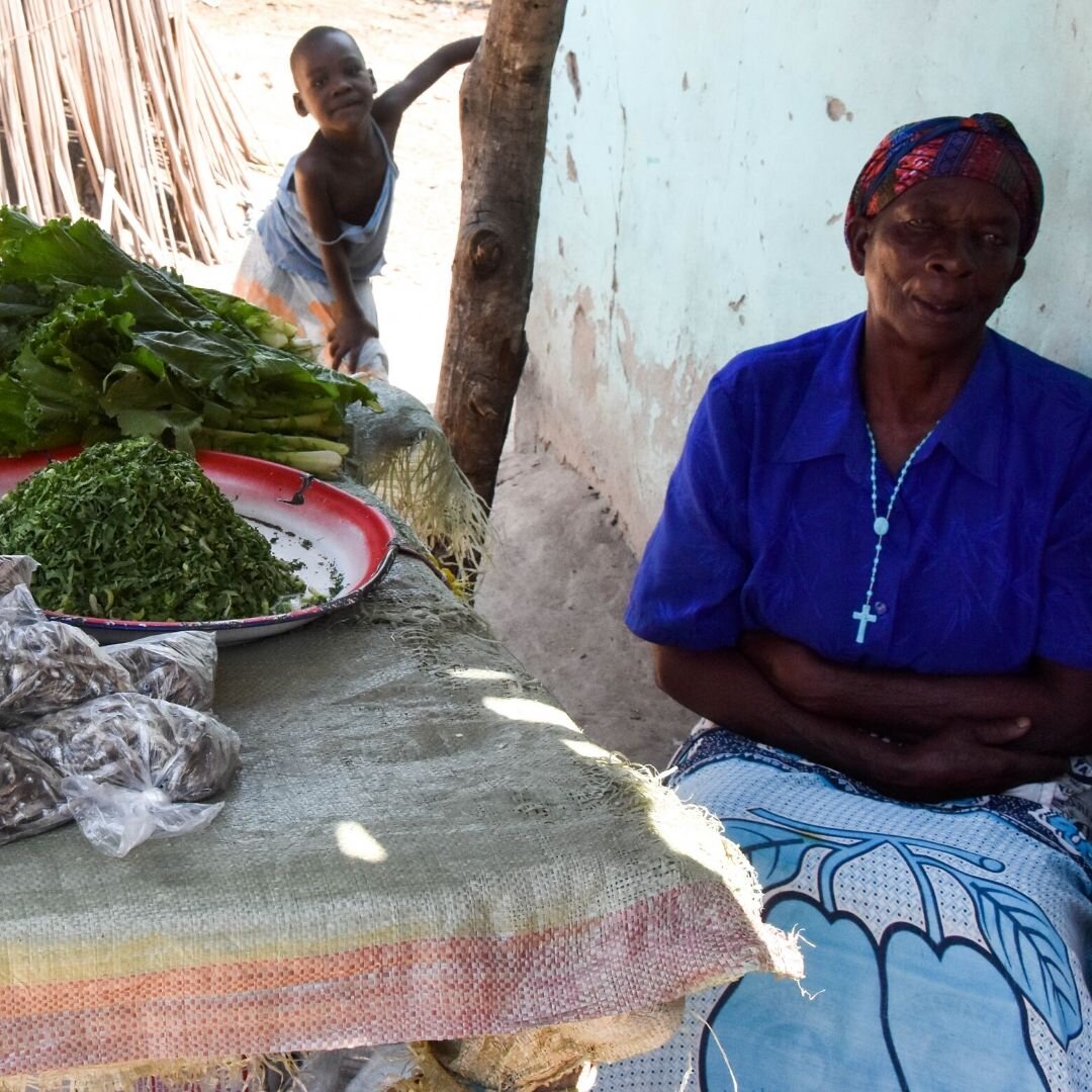 Mama selling a little produce at the market