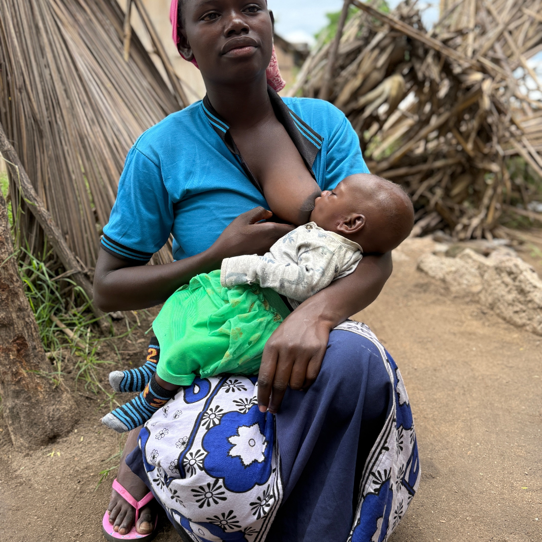 Mother breastfeeding her baby through the SMILE maternal healthcare programme in rural Tanzania