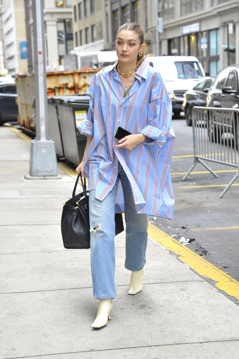 Gigi Hadid Has Found The Ideal Accessory For Her Boyfriend Shirt.png