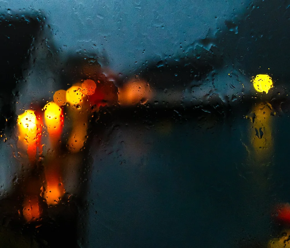 Rain on Glass — distant lights dissolving into colour in Norway