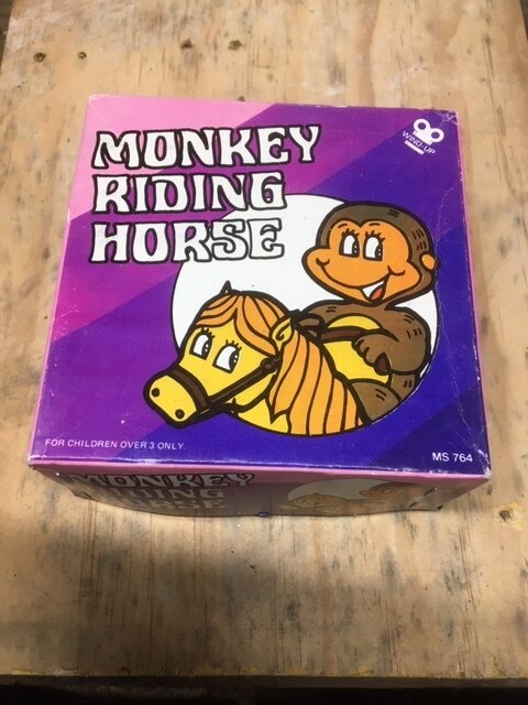 MONKEY RIDING HORSE TIN TOY